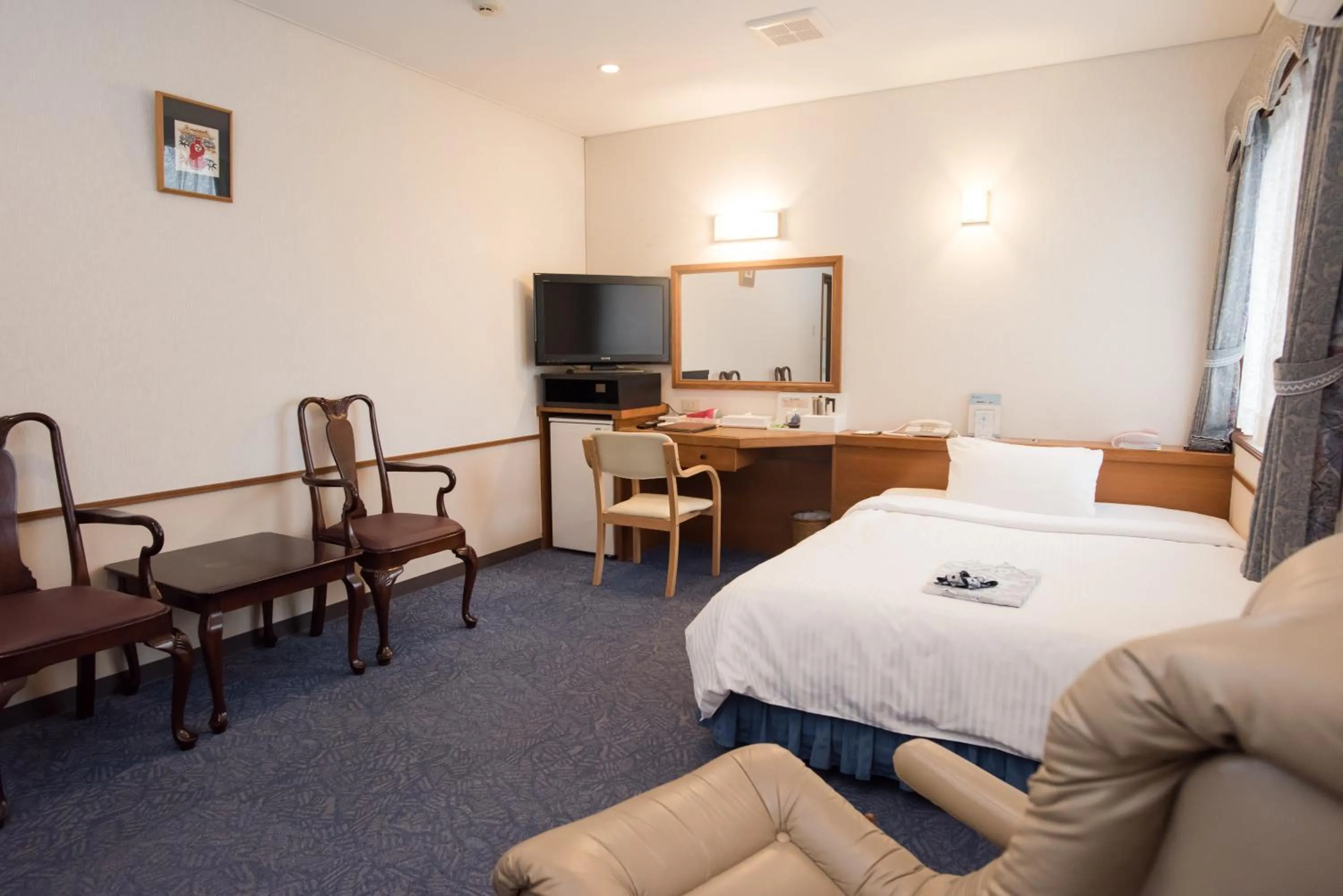 Photo of the whole room, Bed in Crown Hotel Okinawa