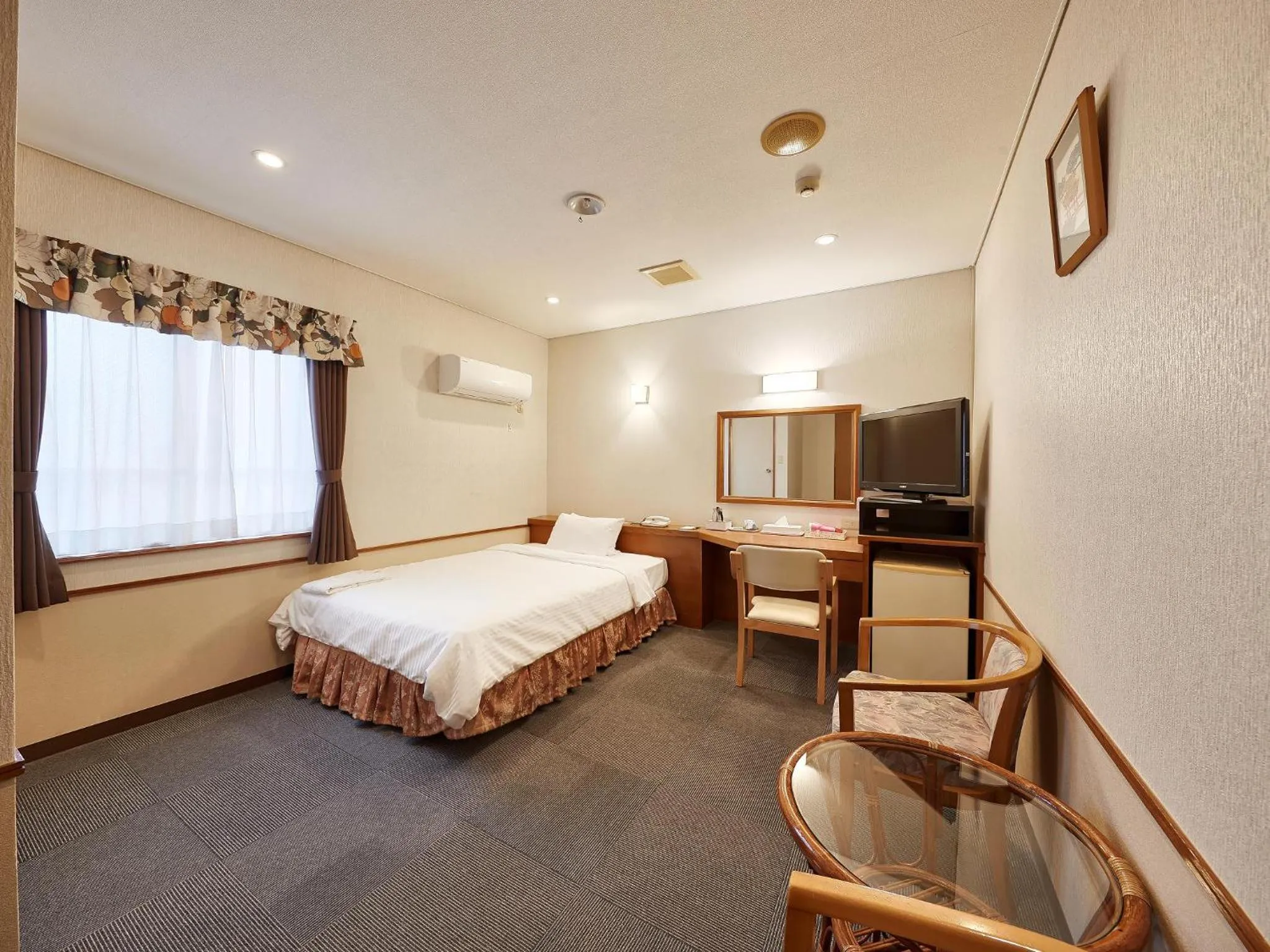 Photo of the whole room, Bed in Crown Hotel Okinawa
