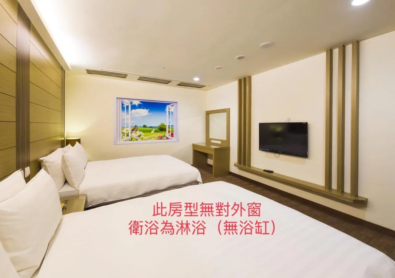 Bed in Cheng Wan Grand Hotel