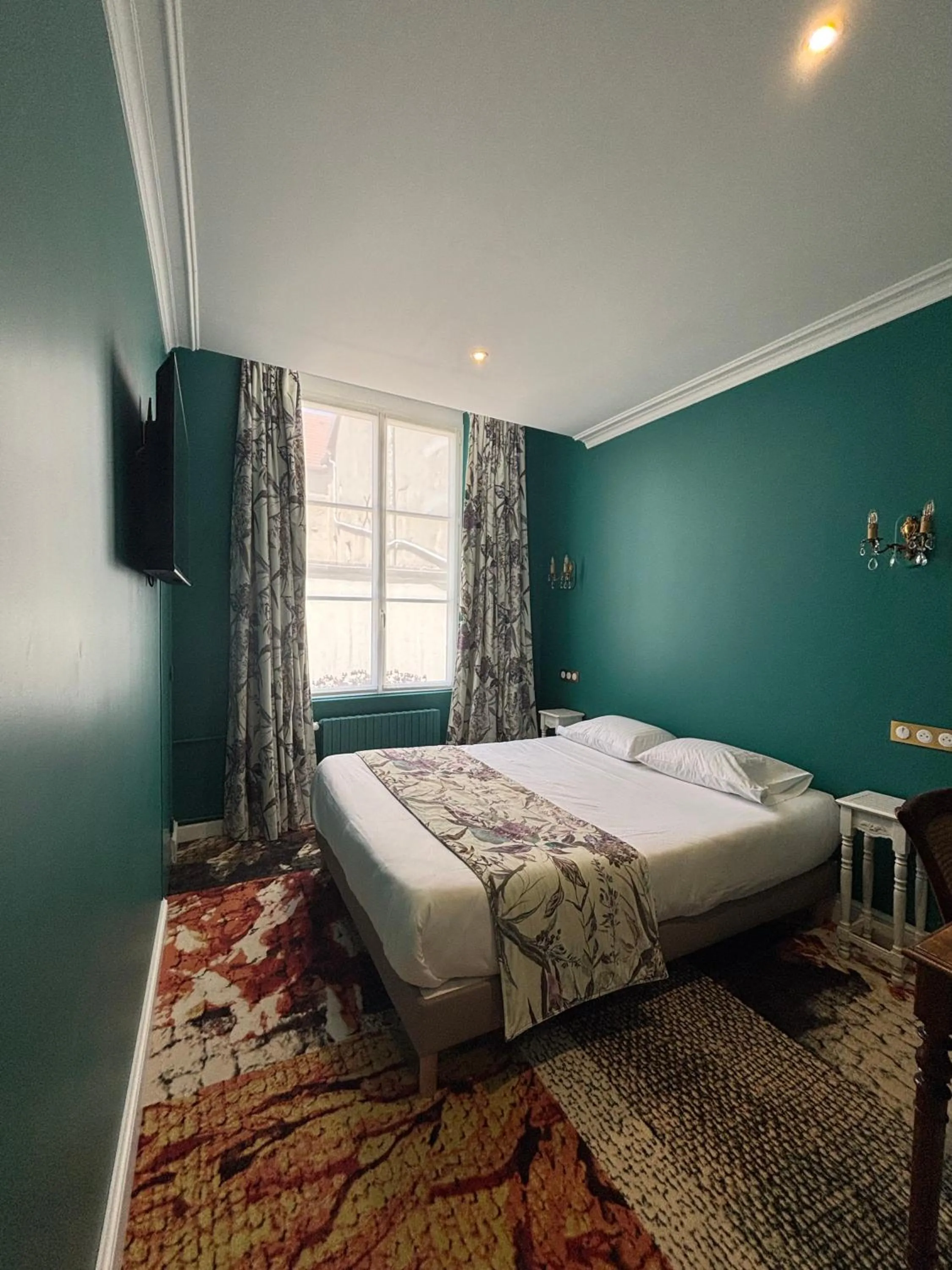 Bed in Hotel De La Poste