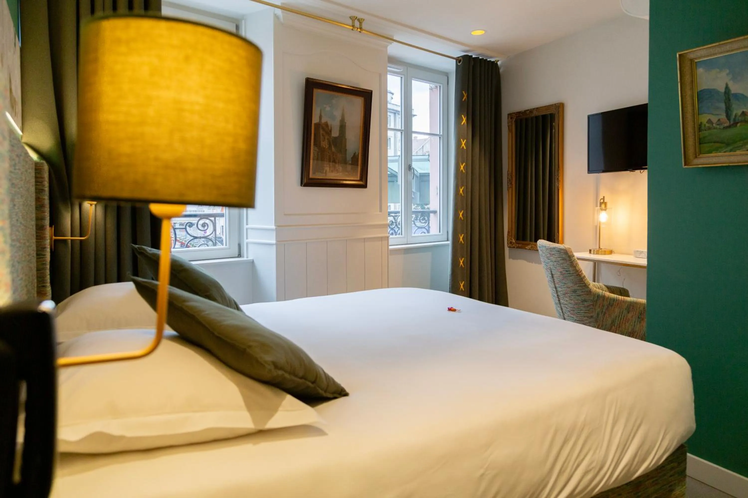 Bed in Le Kléber Hôtel