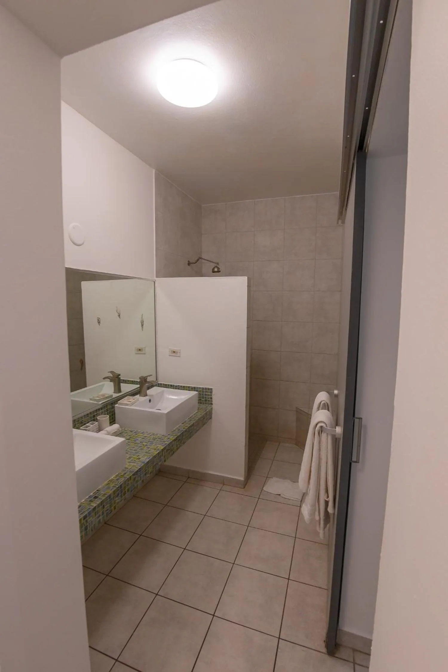 Shower in Casa Verde Hotel - Steps to the Beach, Pool, Restaurant & Bar