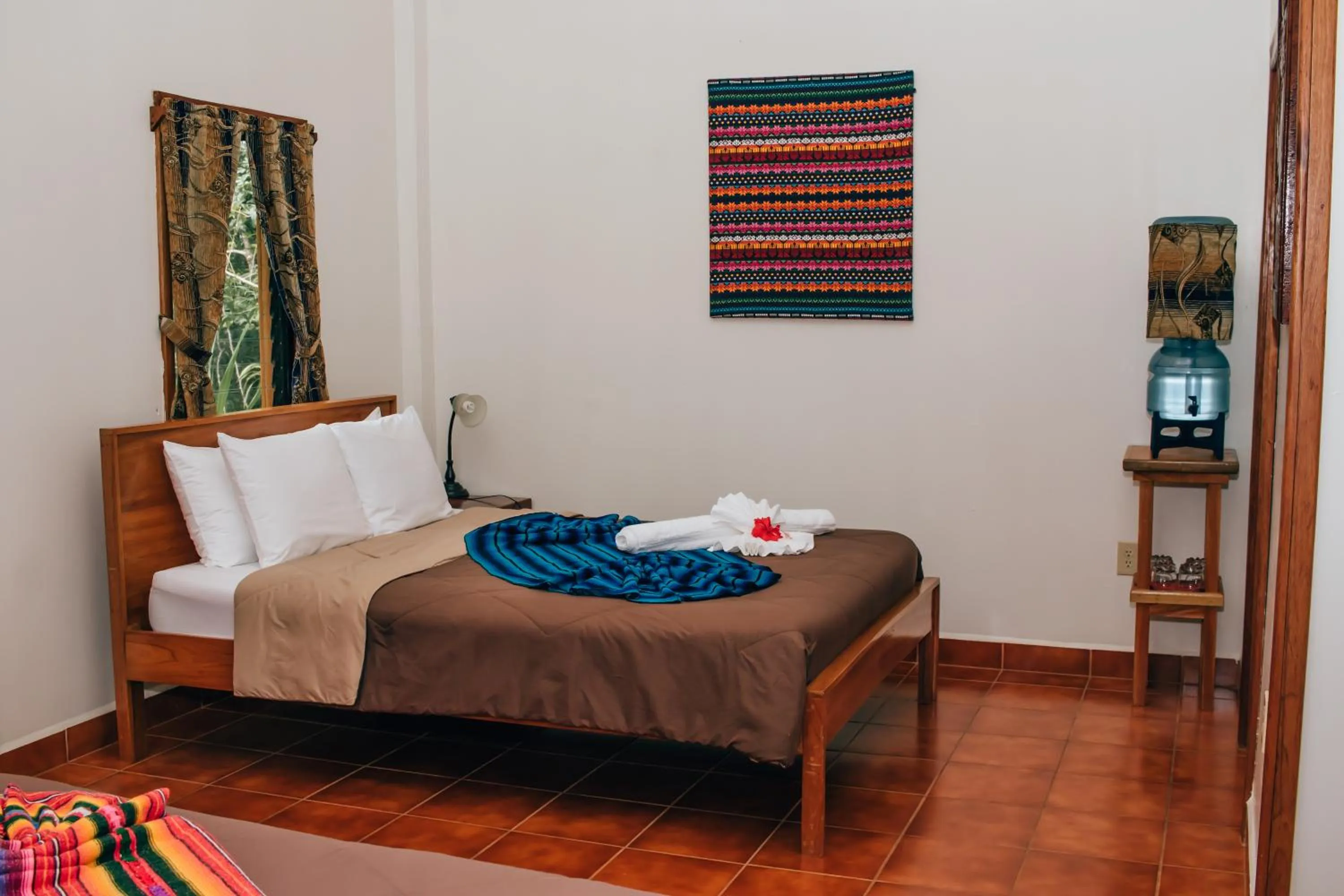 Bed in Mariposa Jungle Lodge