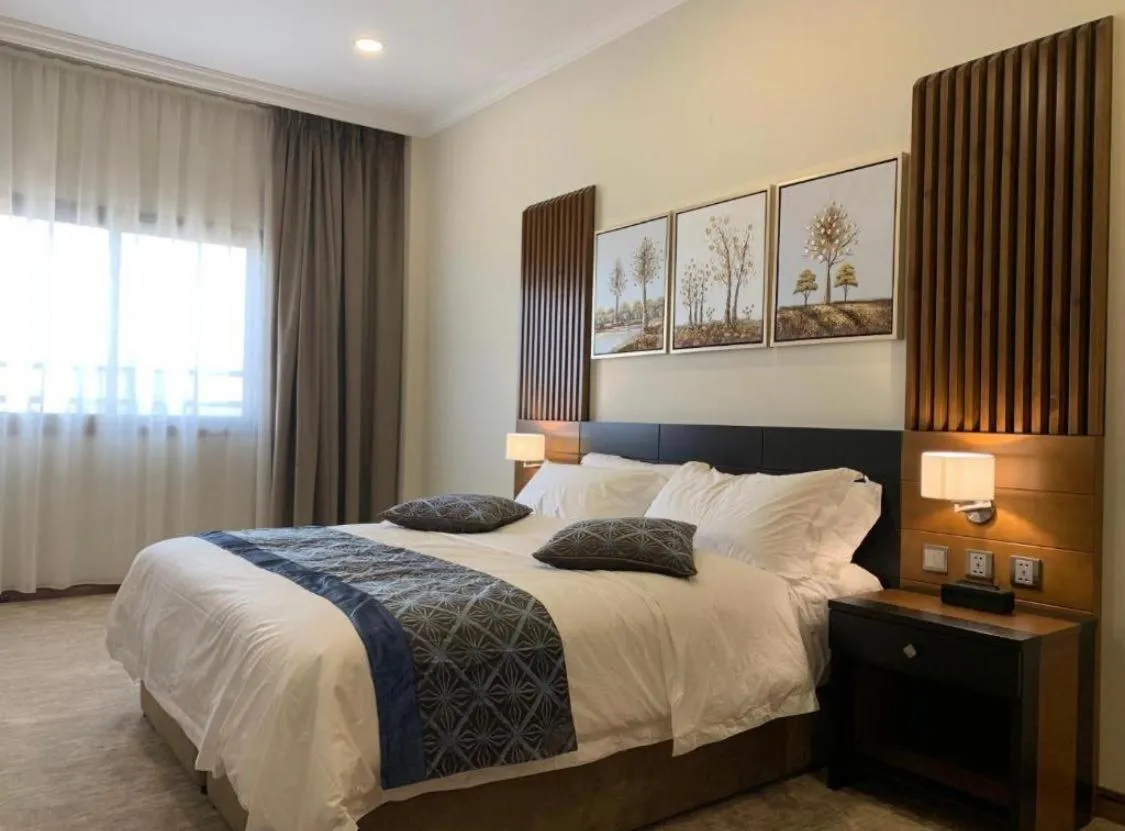 Bed in Tripper Inn - تريبر إن