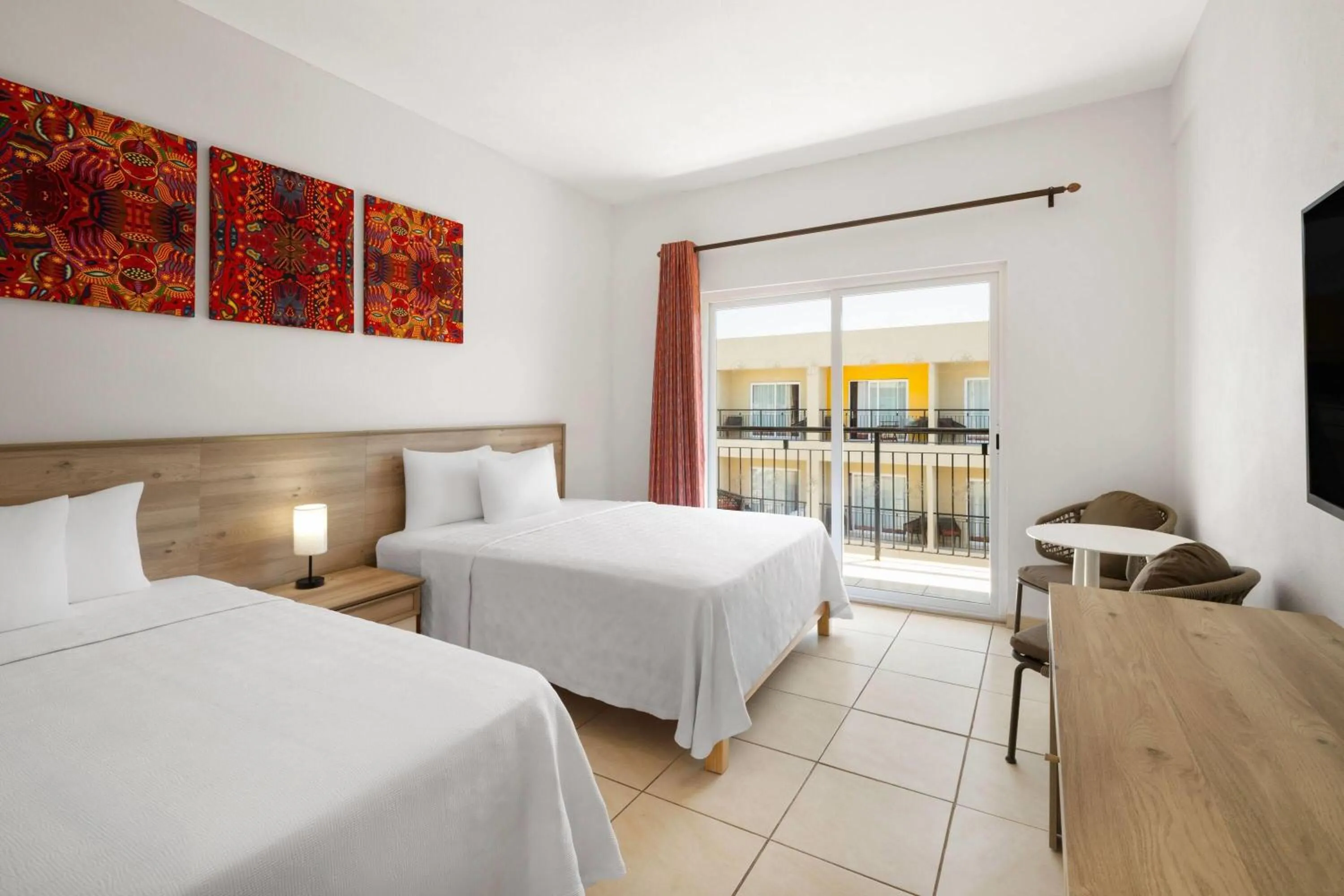 Photo of the whole room, Bed in Decameron Isla Coral Guayabitos, Ramada All-Inclusive Resort