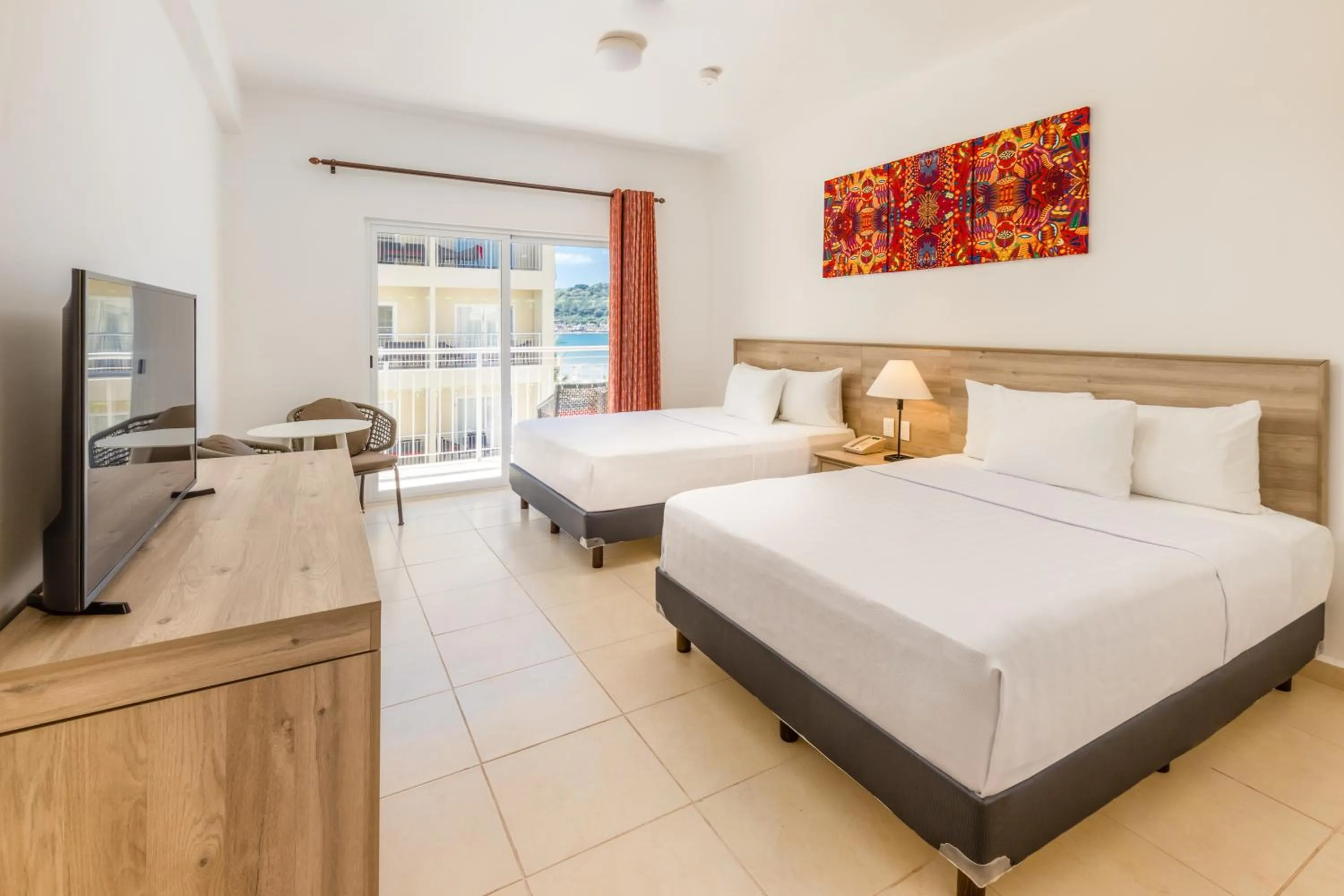 Bed in Decameron Isla Coral Guayabitos, Ramada All-Inclusive Resort
