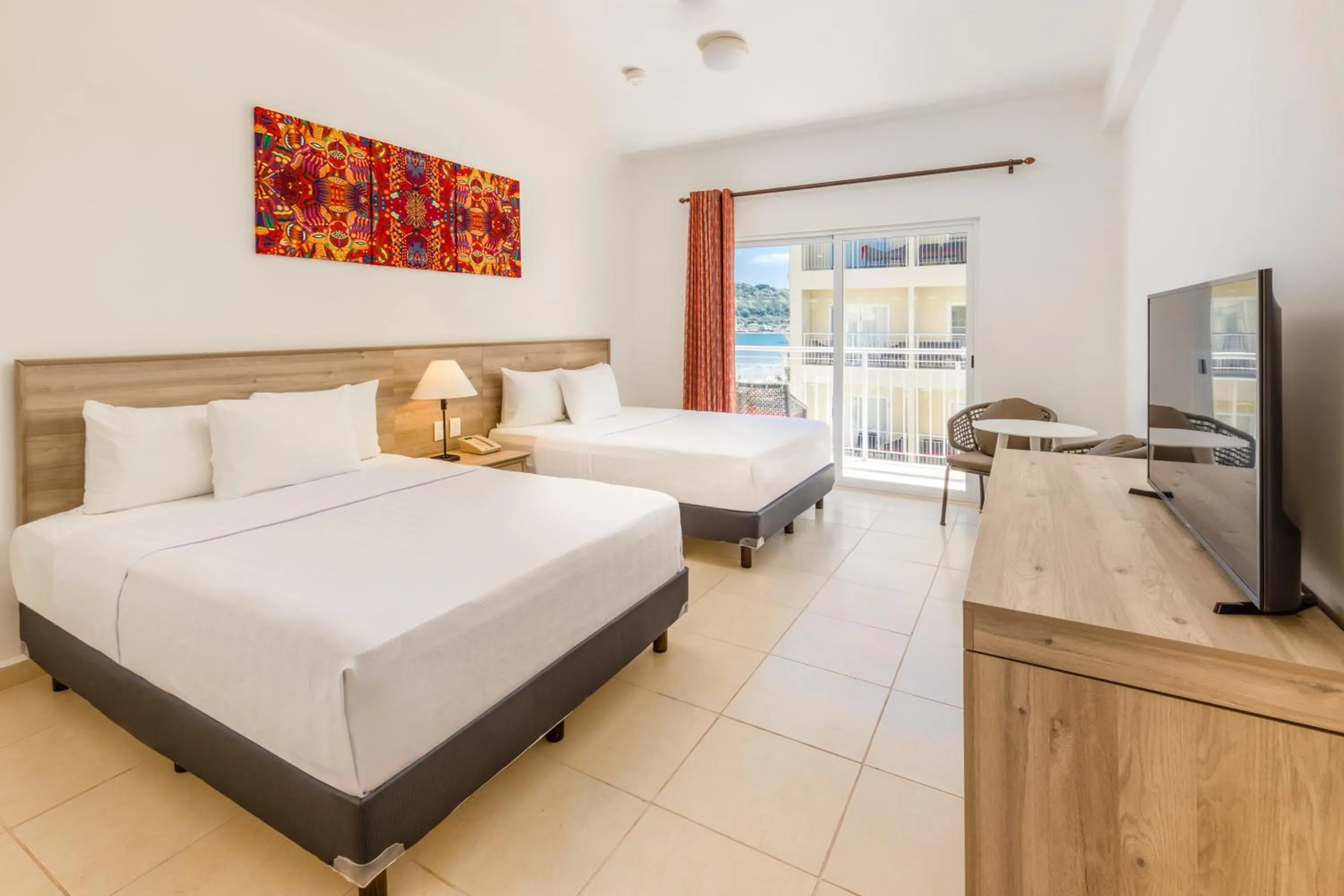 Bed in Decameron Isla Coral Guayabitos, Ramada All-Inclusive Resort
