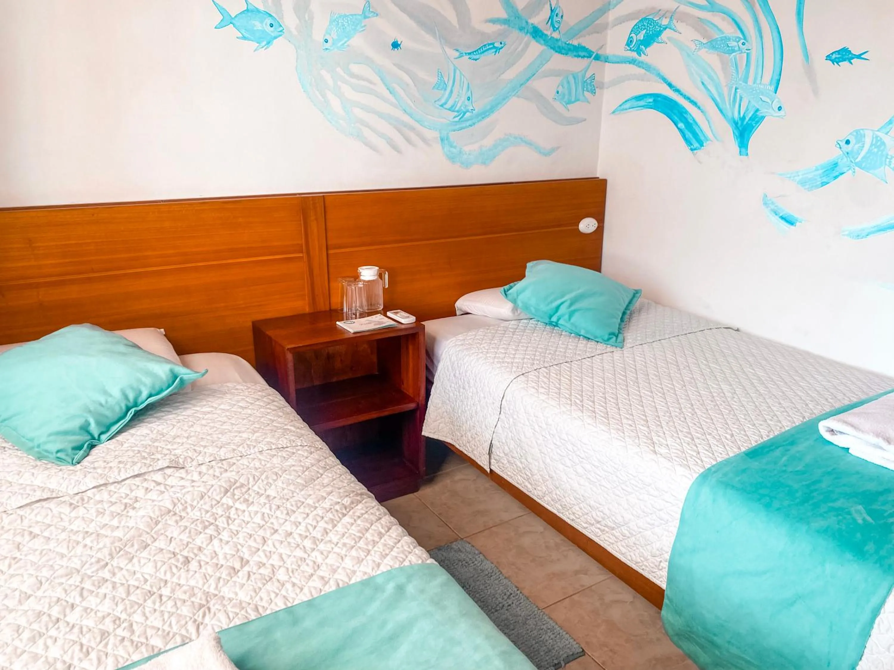 Bed in Hotel Coral Blanco with high speed internet Starlink and Galapagos Tour Operator