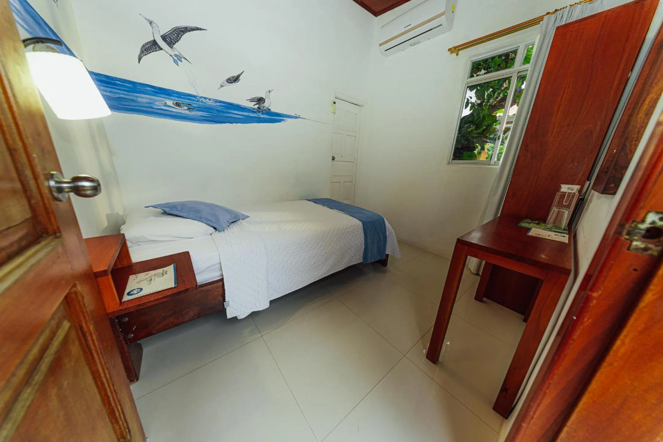 Bed in Hotel Coral Blanco with high speed internet Starlink and Galapagos Tour Operator