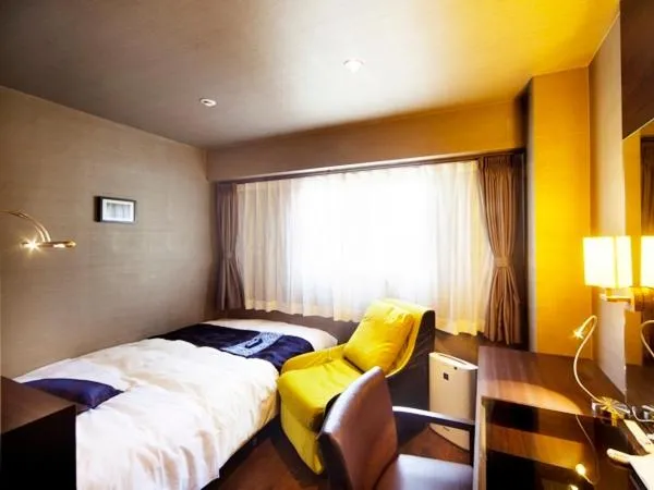 Bed in Silk Inn Kagoshima