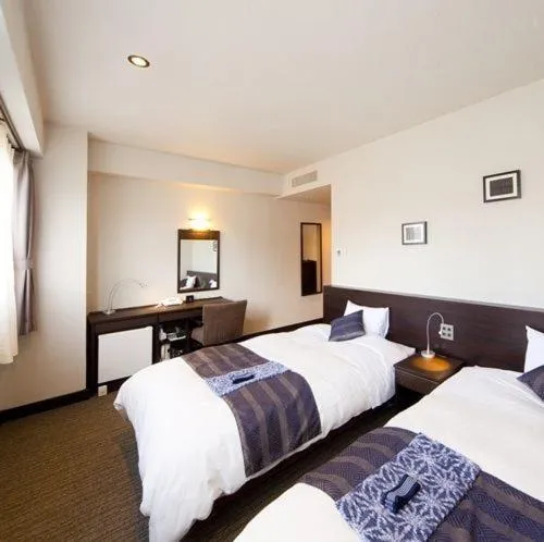 Photo of the whole room, Bed in Silk Inn Kagoshima