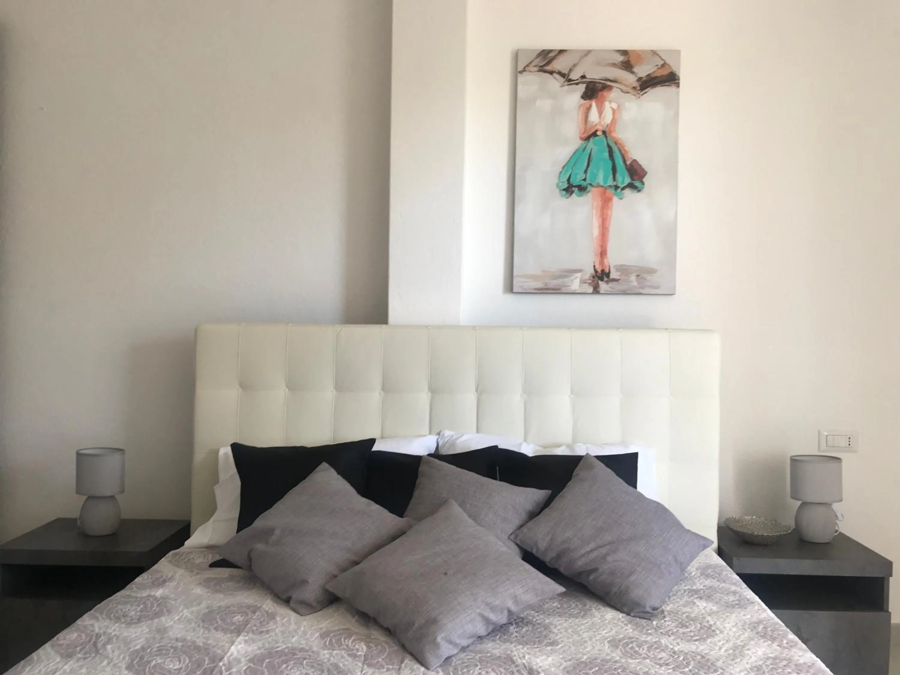 Bed in Cala Caterina Rooms