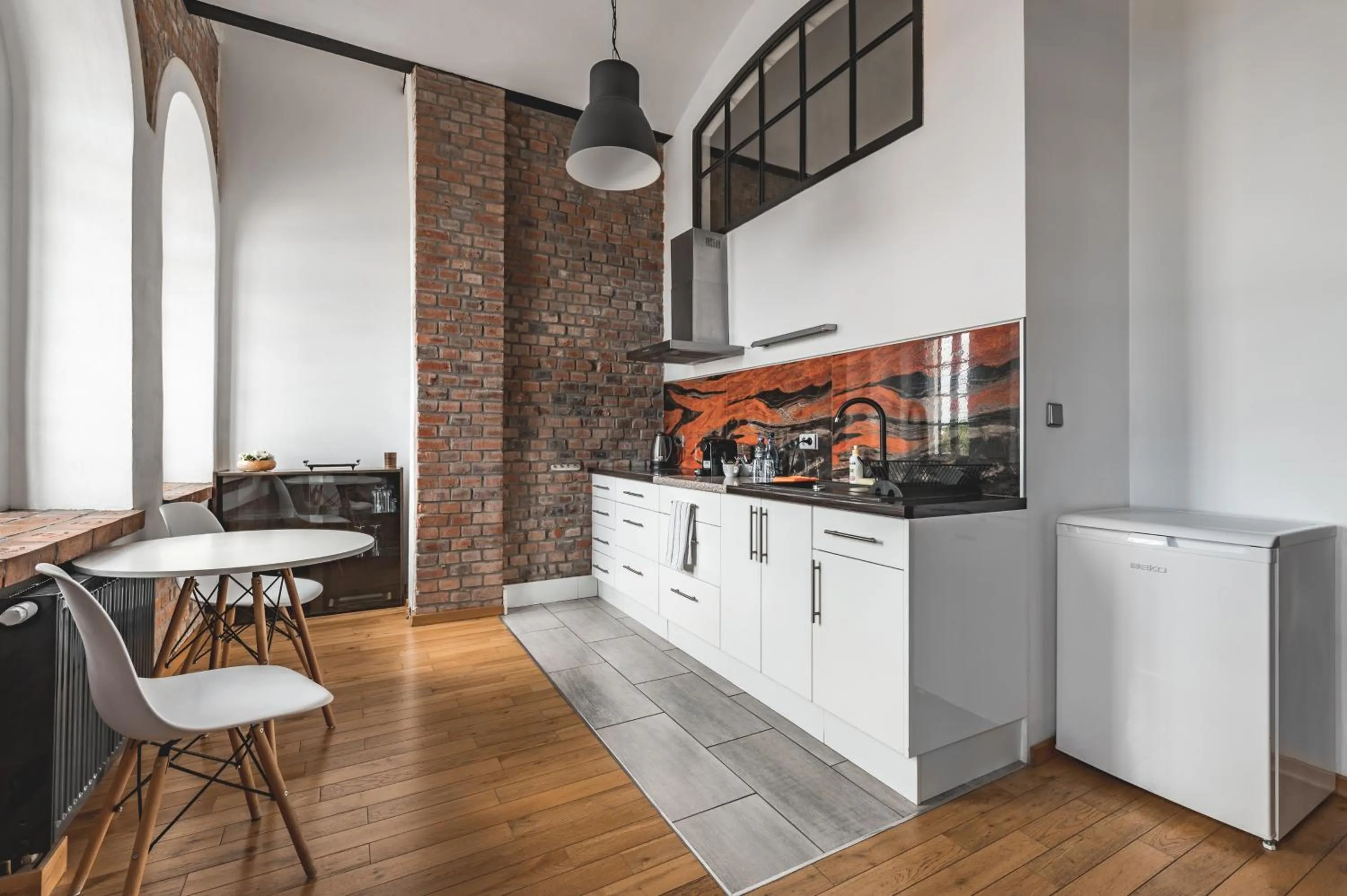 Kitchen or kitchenette in Aparthotel Stara Przędzalnia