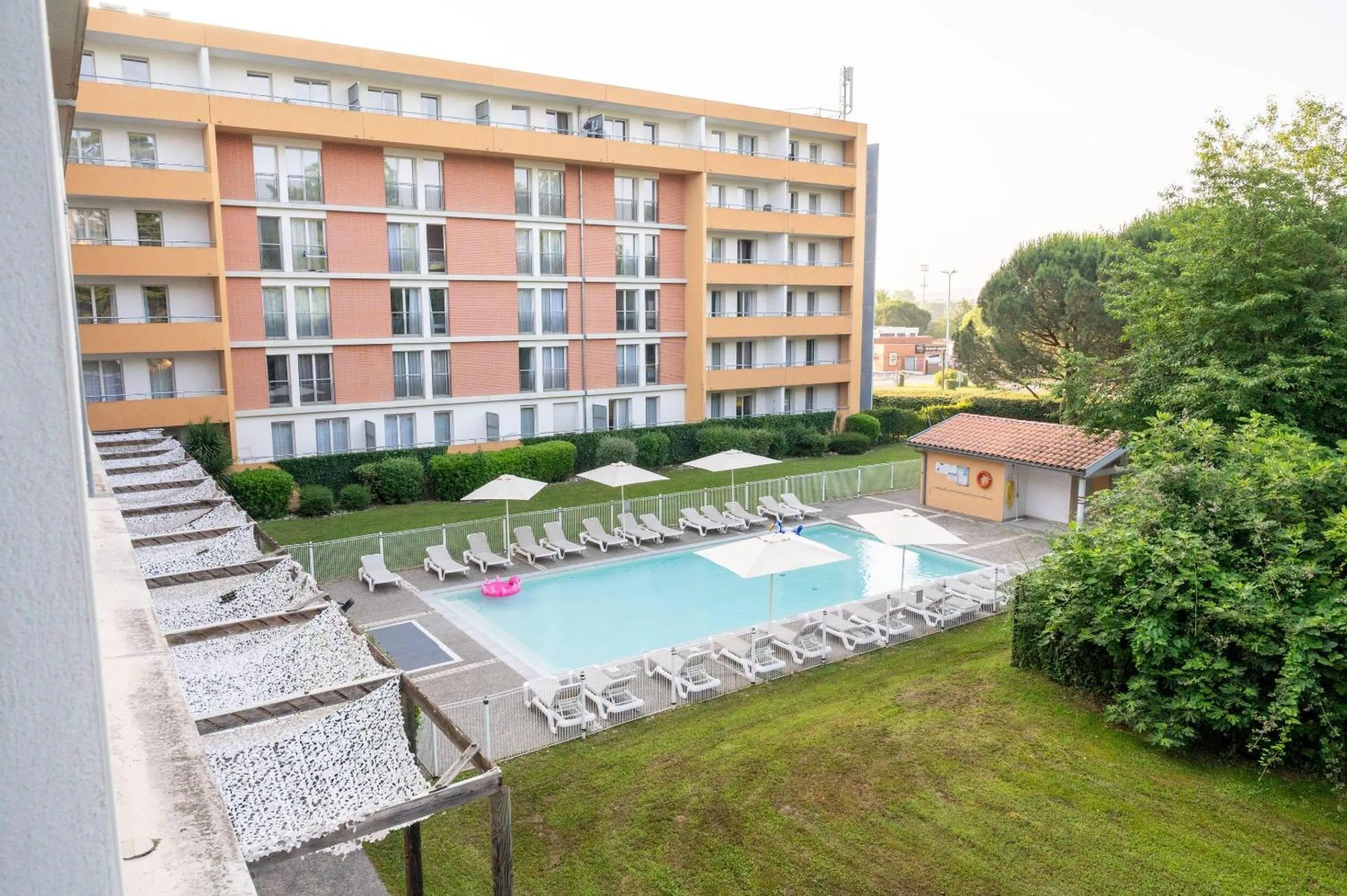 Swimming pool in Comfort Aparthotel Toulouse Métropole
