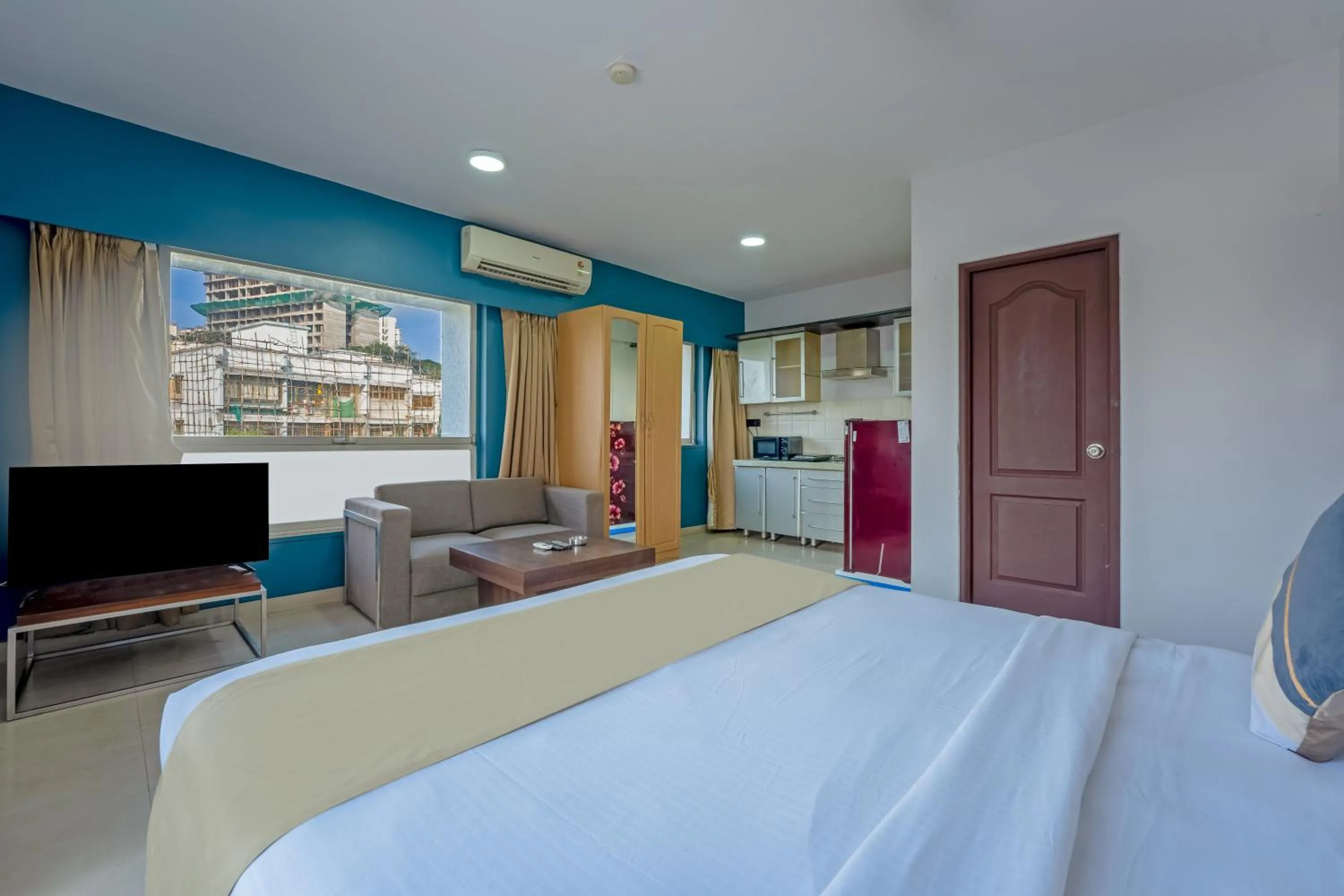 Bed in asar Landmark Suites Mumbai International Airport by Orion Hotels