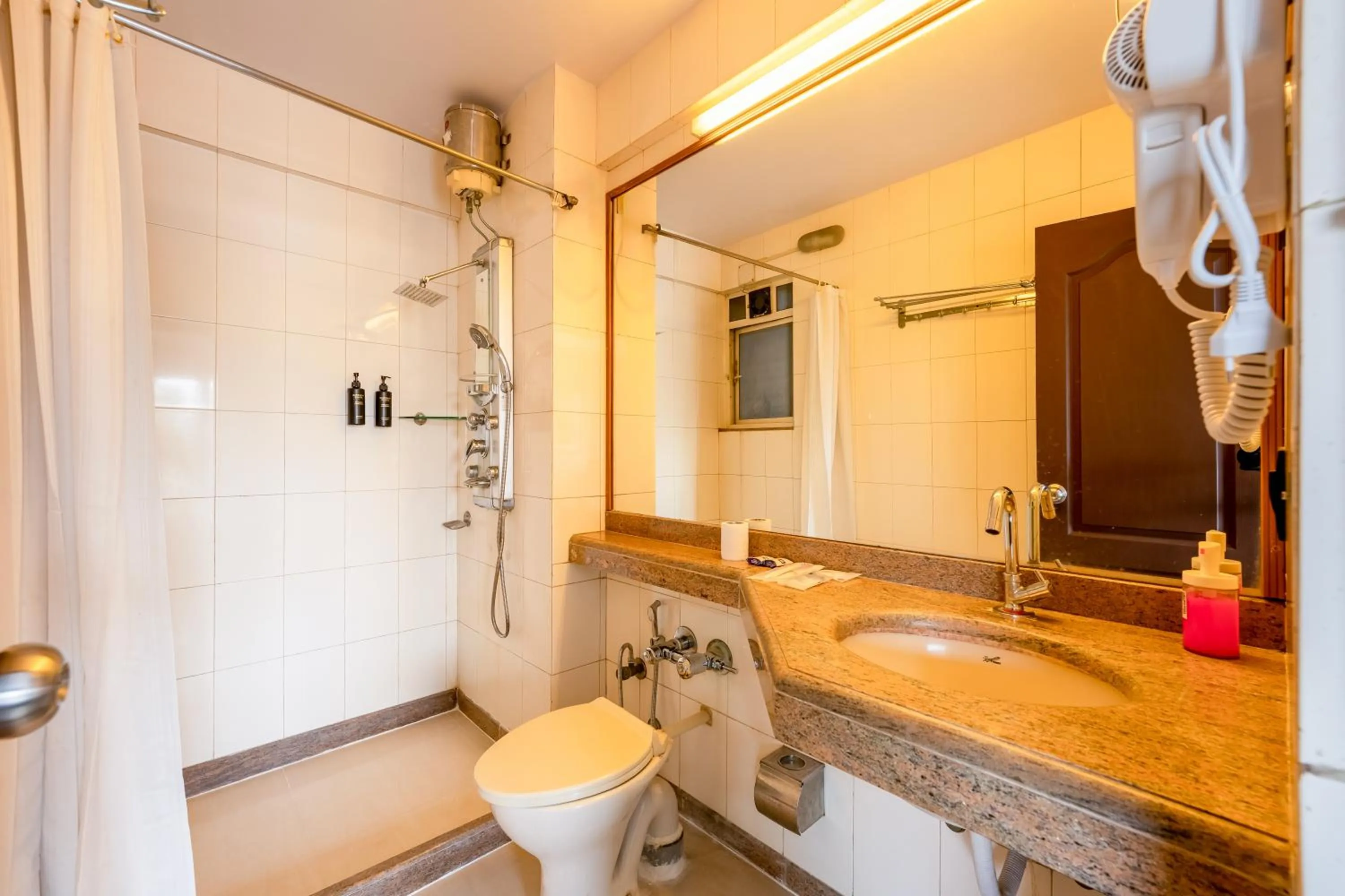 Bathroom in asar Landmark Suites Mumbai International Airport by Orion Hotels