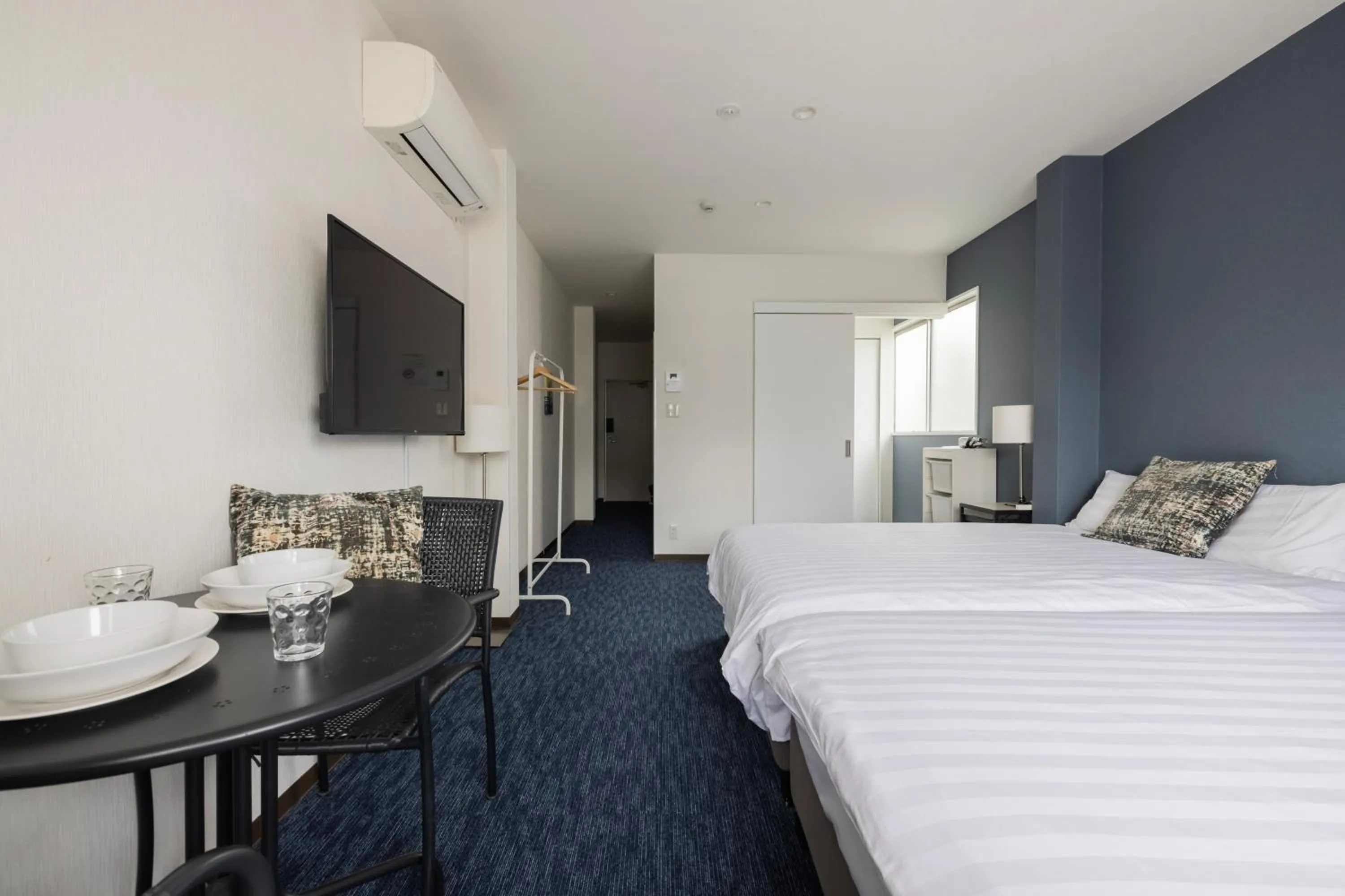 Bed in Namba Garden Square Apartment