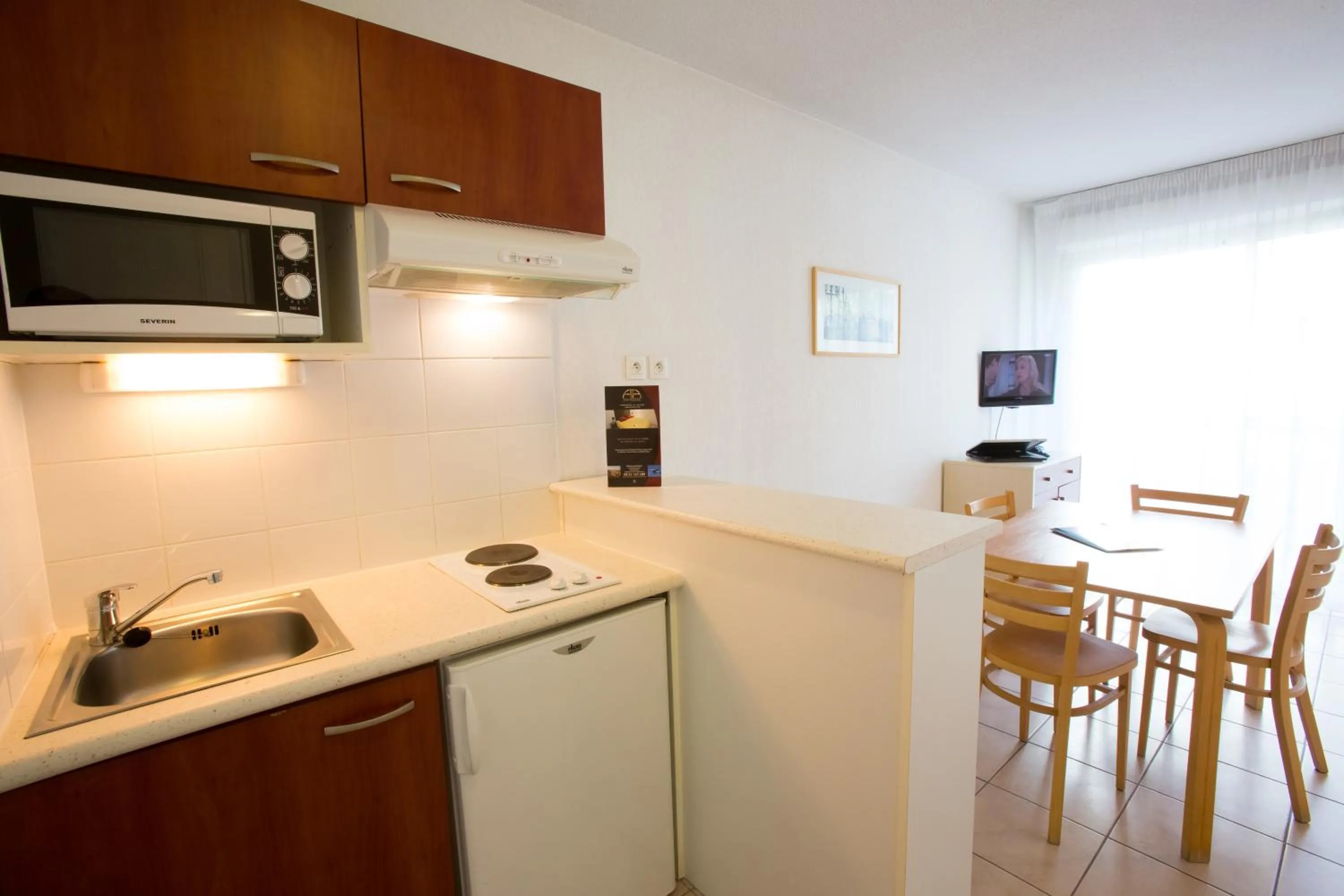 Kitchen or kitchenette in All Suites Appart Hôtel - Bordeaux - Mérignac Aéroport