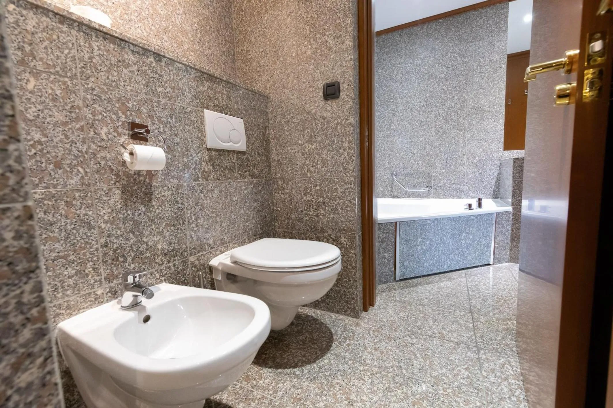 Bathroom in Goldstar Apartments & Suites