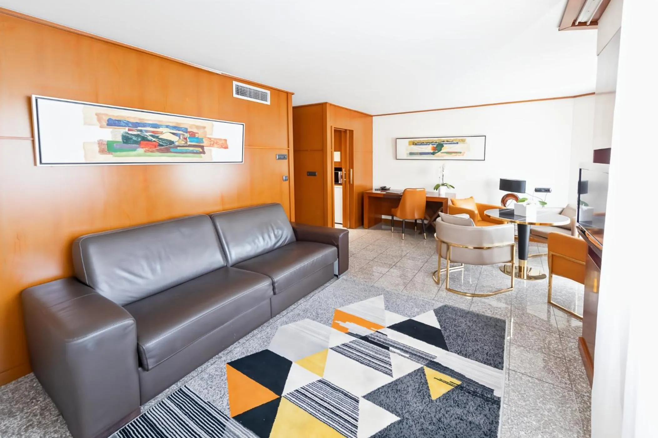 Living room in Goldstar Apartments & Suites