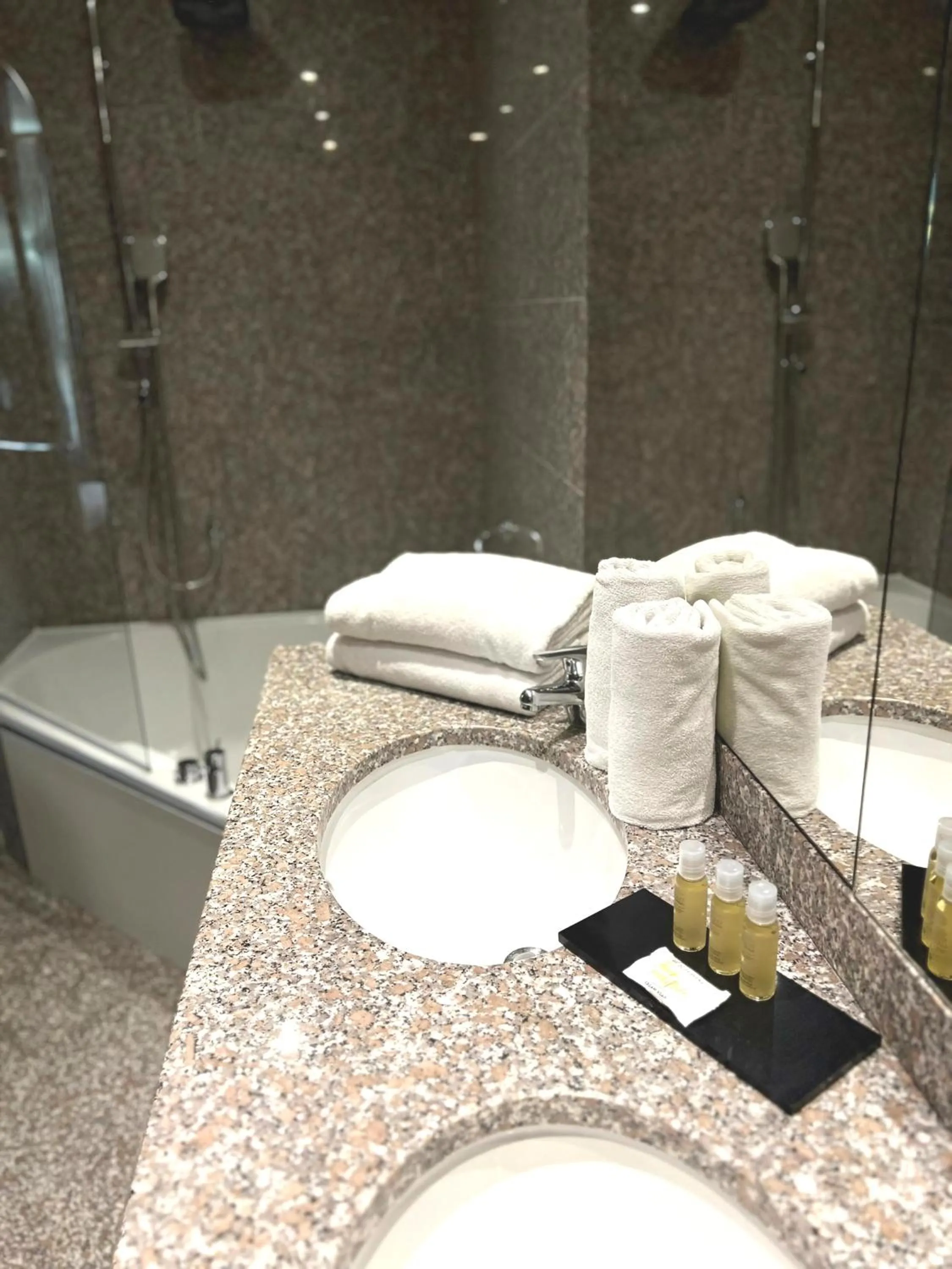 Shower in Goldstar Apartments & Suites