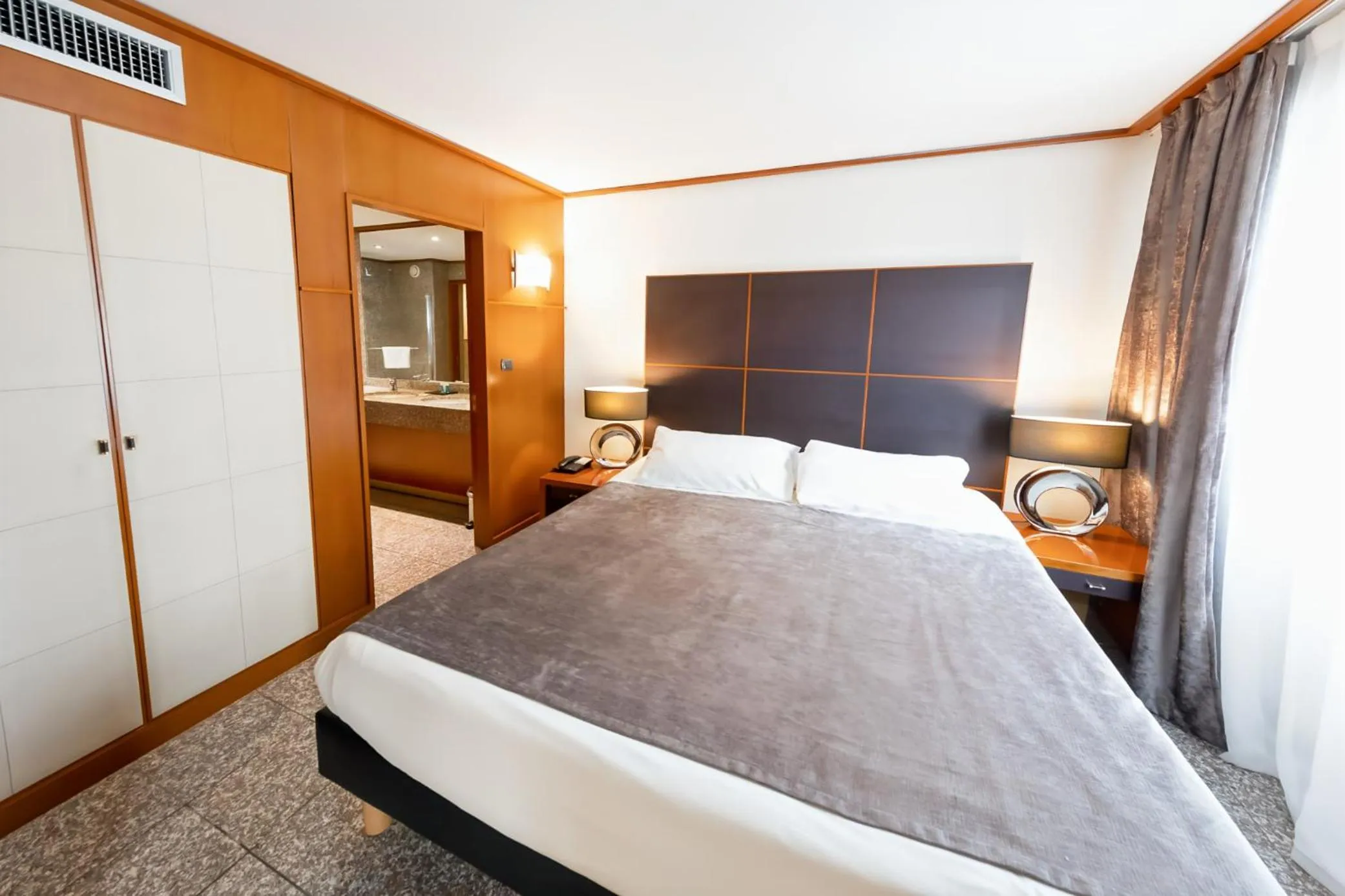 Bed in Goldstar Apartments & Suites