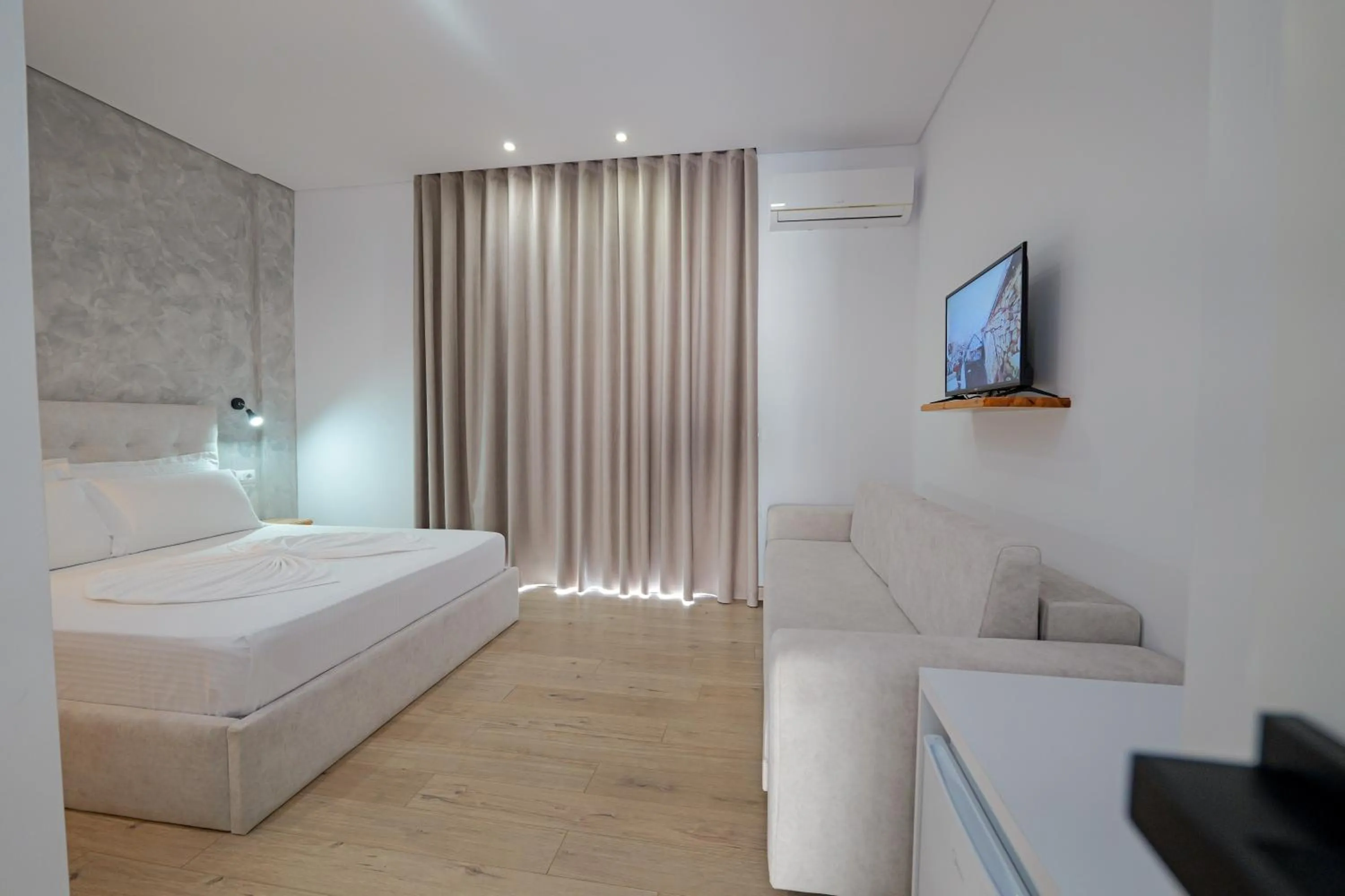 Seating area, Bed in Villa Juna Beach