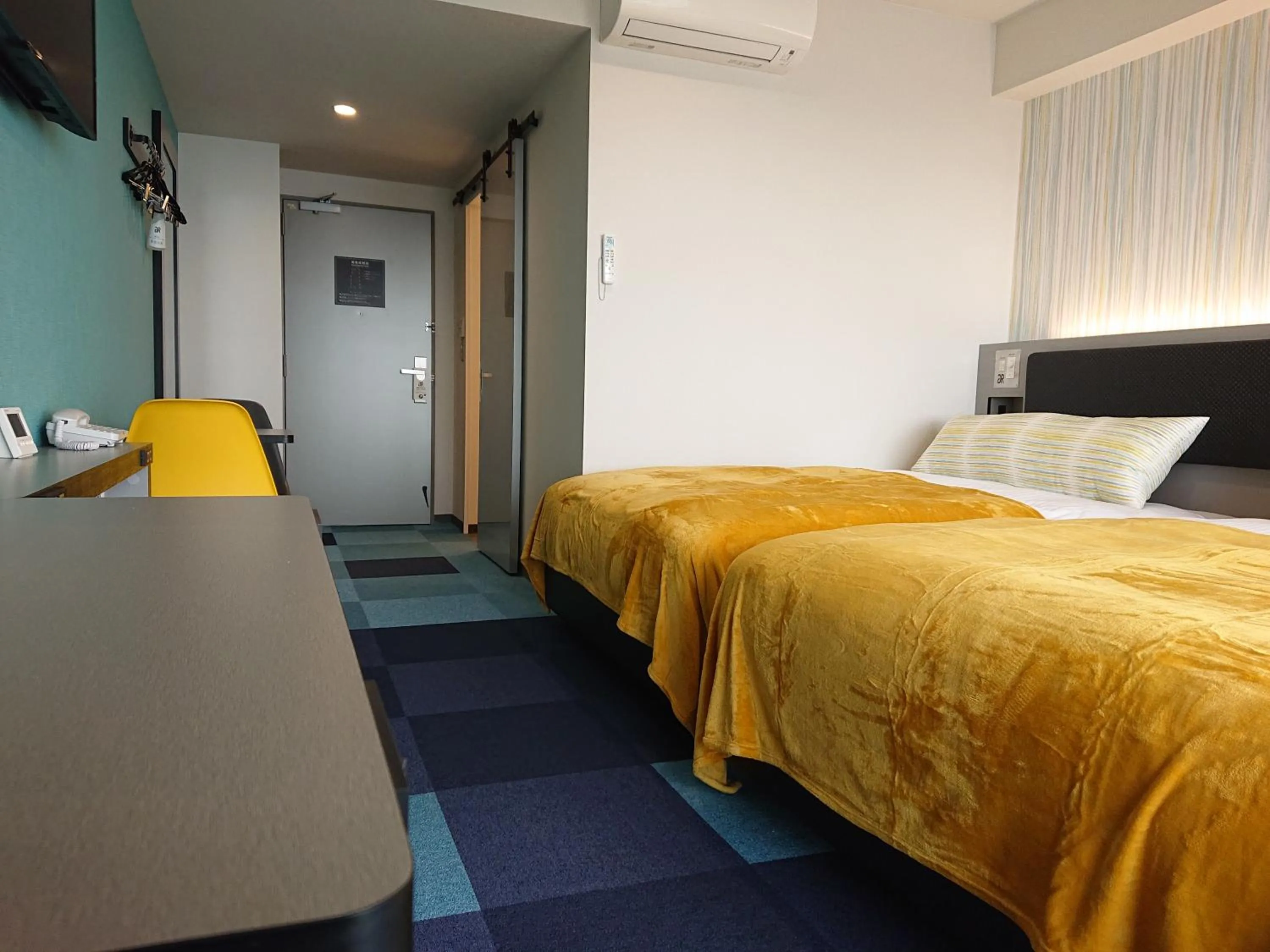 Bed in Green Rich Hotel Okinawa Nago (Artificial hot spring Futamata Yunohana)