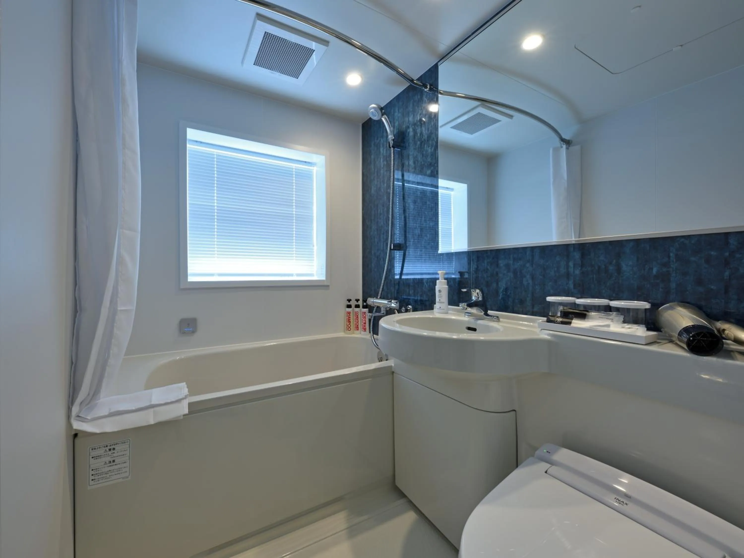 Bathroom in Green Rich Hotel Okinawa Nago (Artificial hot spring Futamata Yunohana)