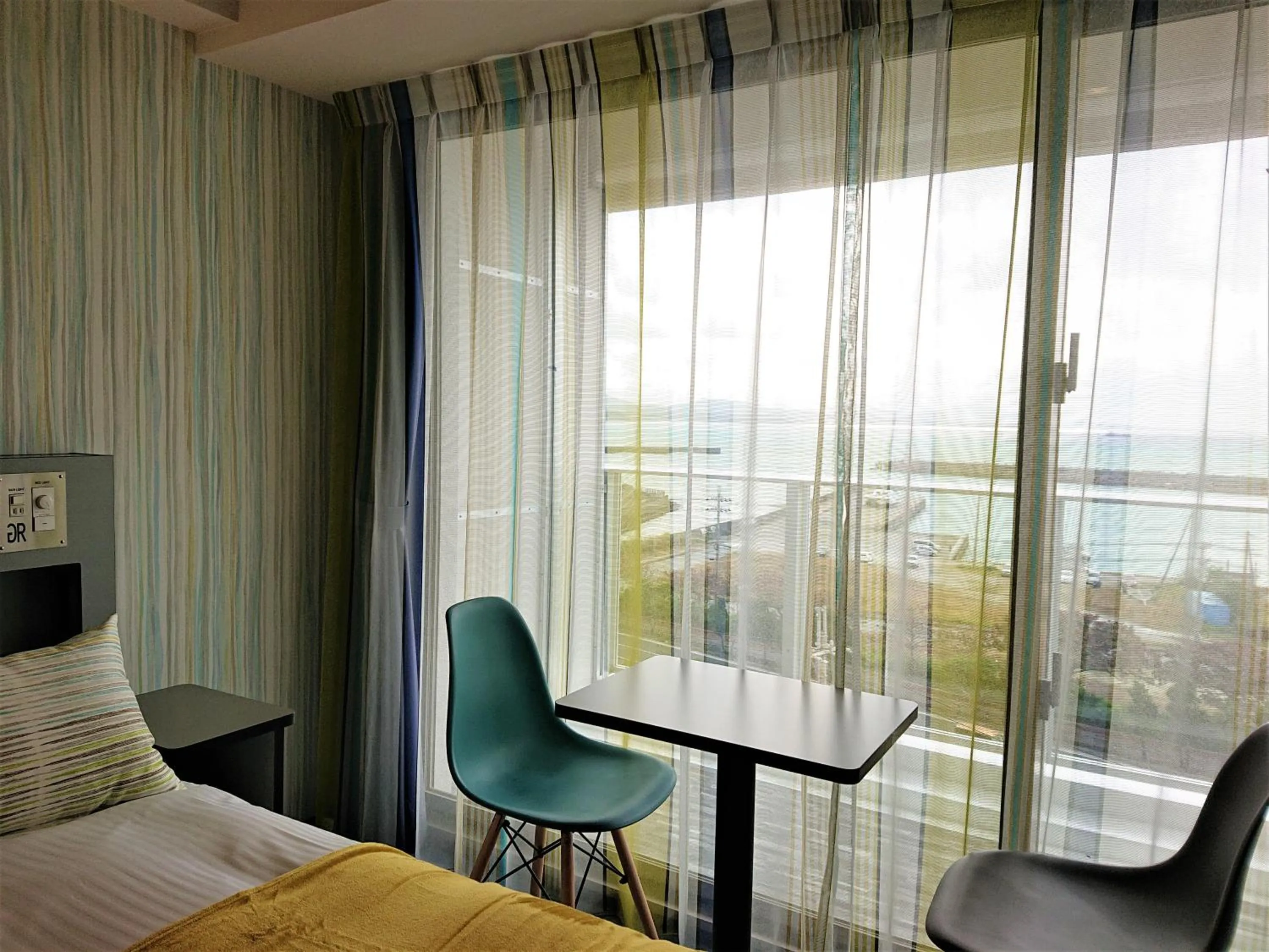 Bed in Green Rich Hotel Okinawa Nago (Artificial hot spring Futamata Yunohana)