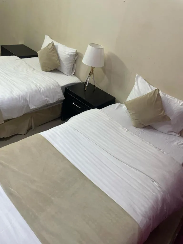 Bed in Arabian Palm Hotel