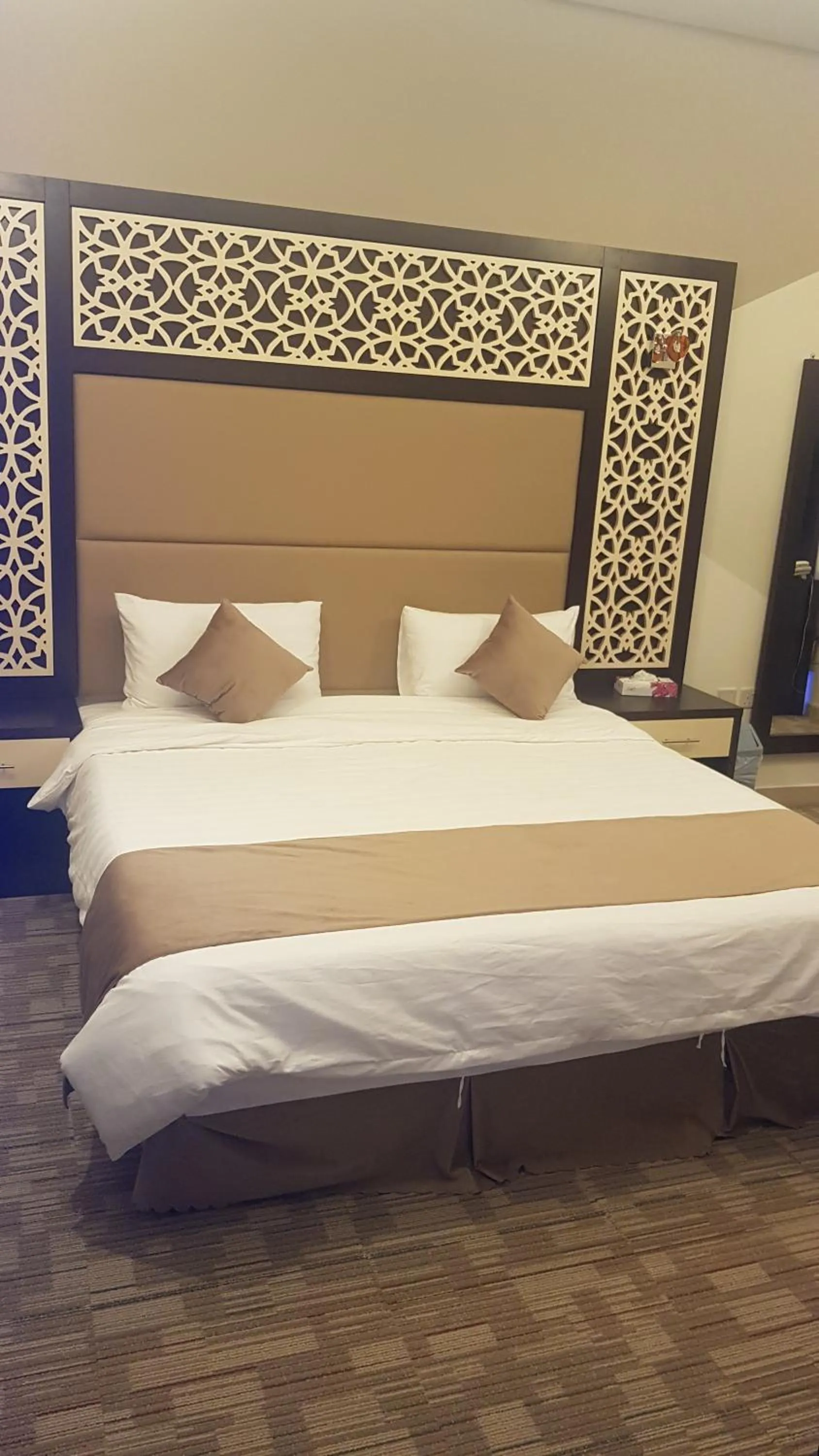 Bed in Arabian Palm Hotel