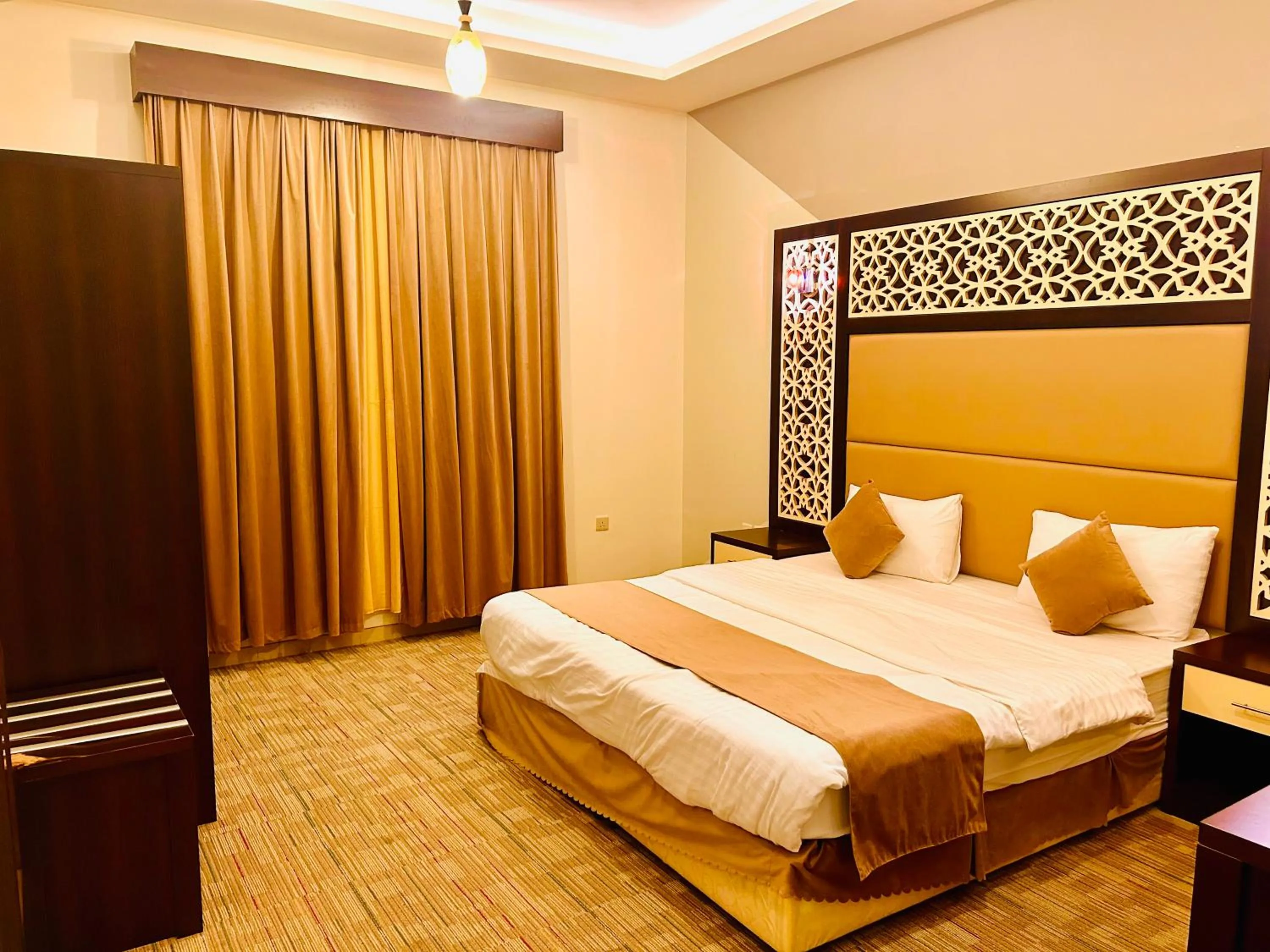 Bed in Arabian Palm Hotel