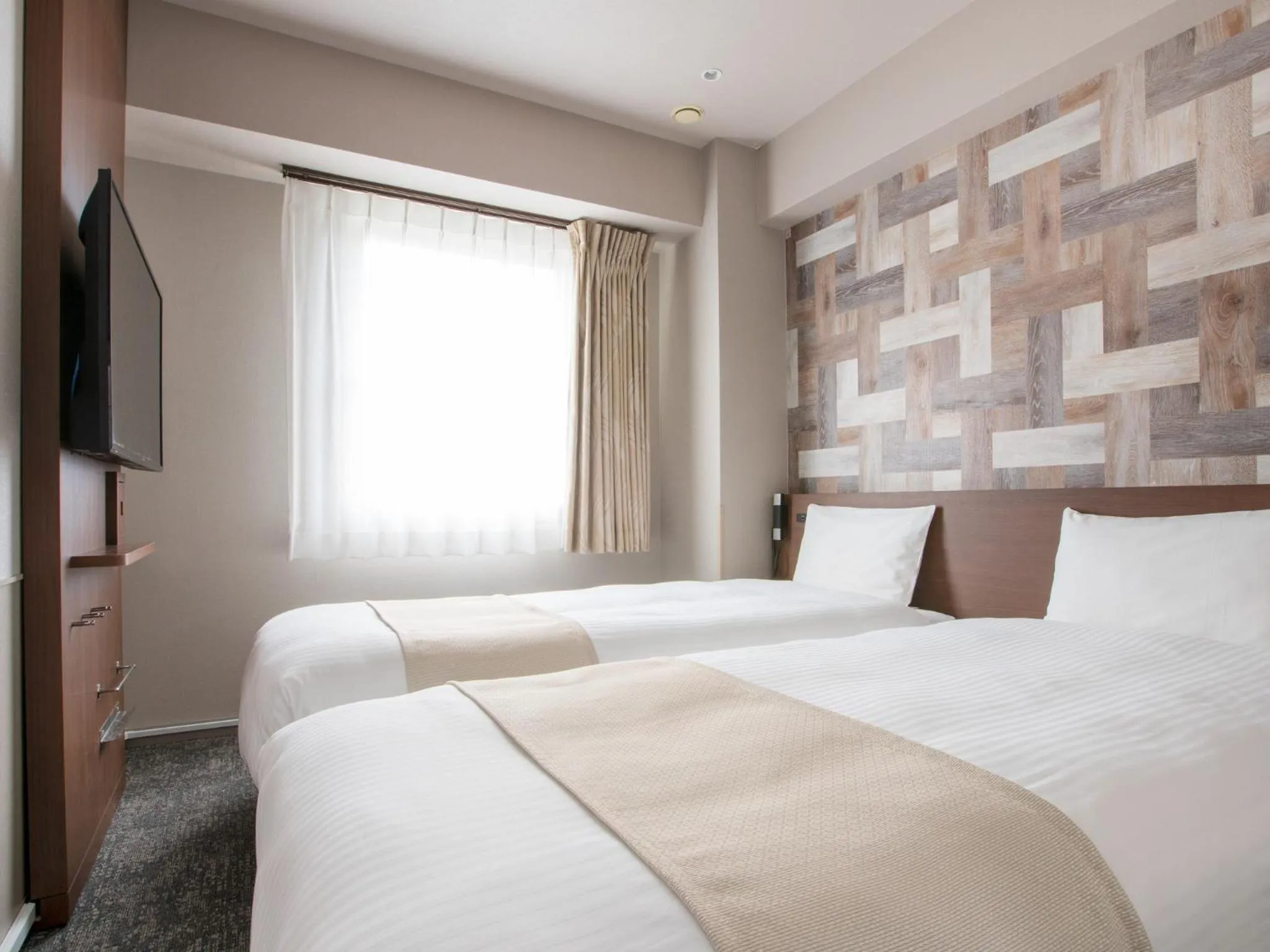 Bed in Hotel Villa Fontaine Tokyo-hatchobori