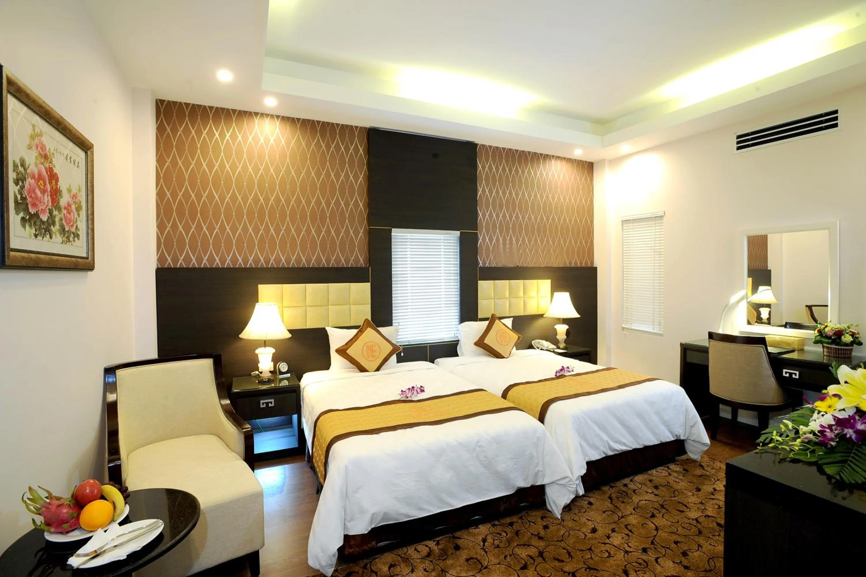 Bed in New Era Hotel & Villa