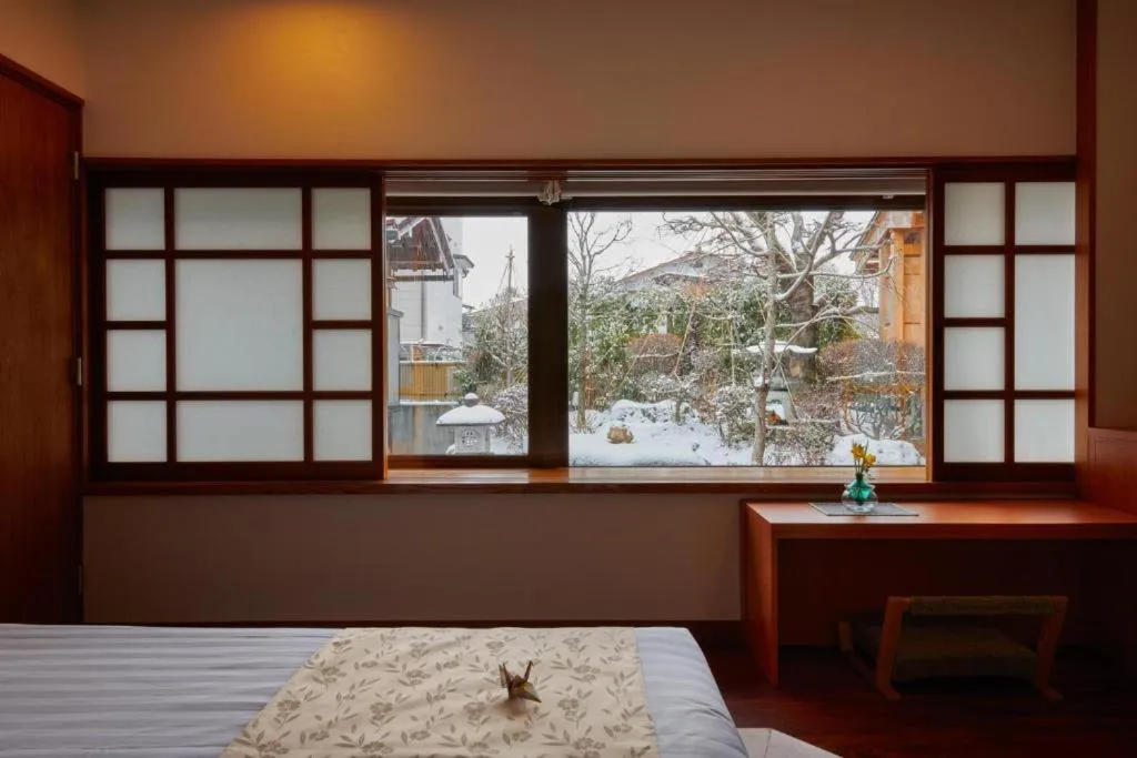 Bed in Ichinomatsu Japanese Modern Hotel