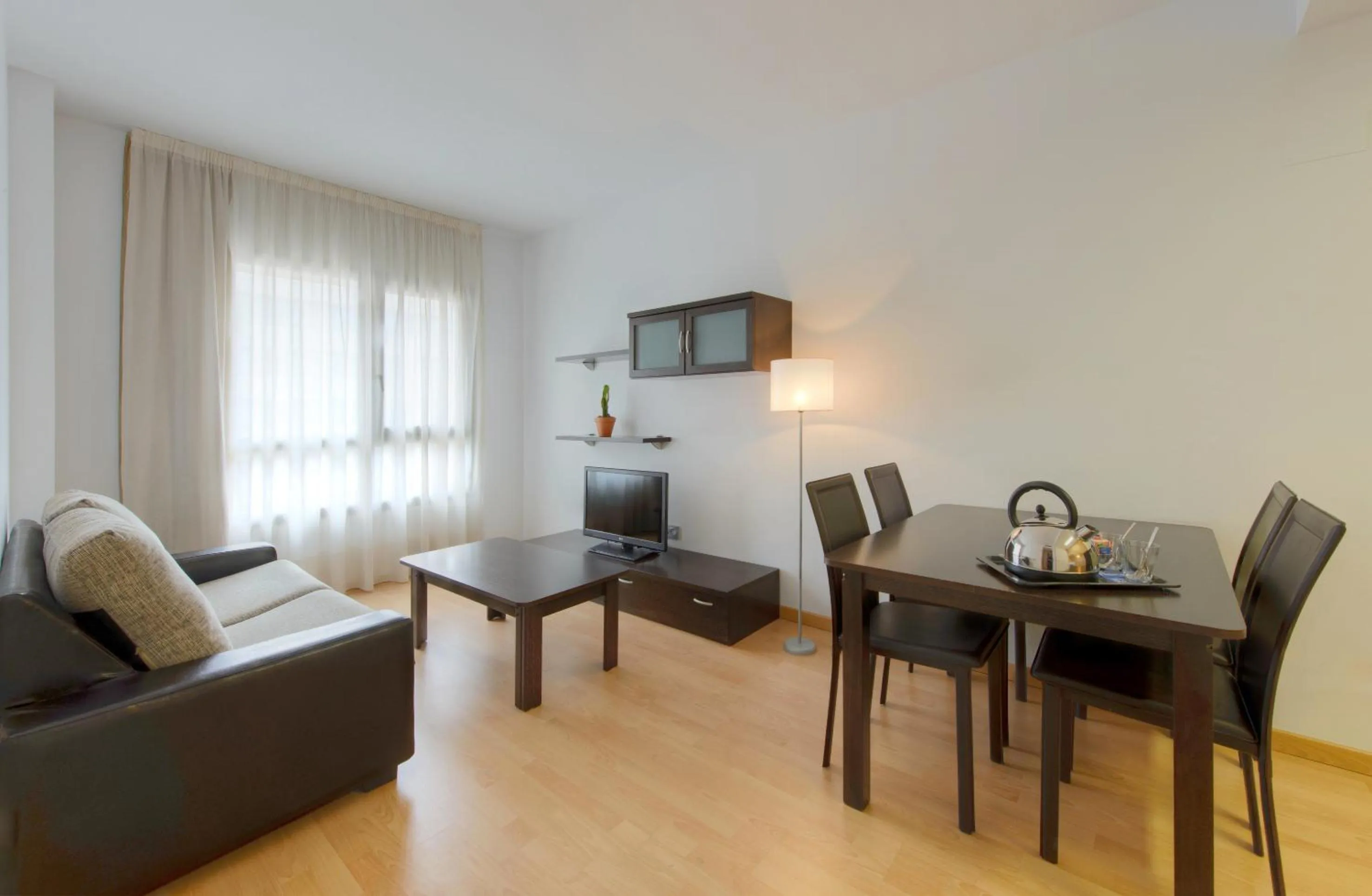 Living room in Madrid Airport Suites, Affiliated by Meliá