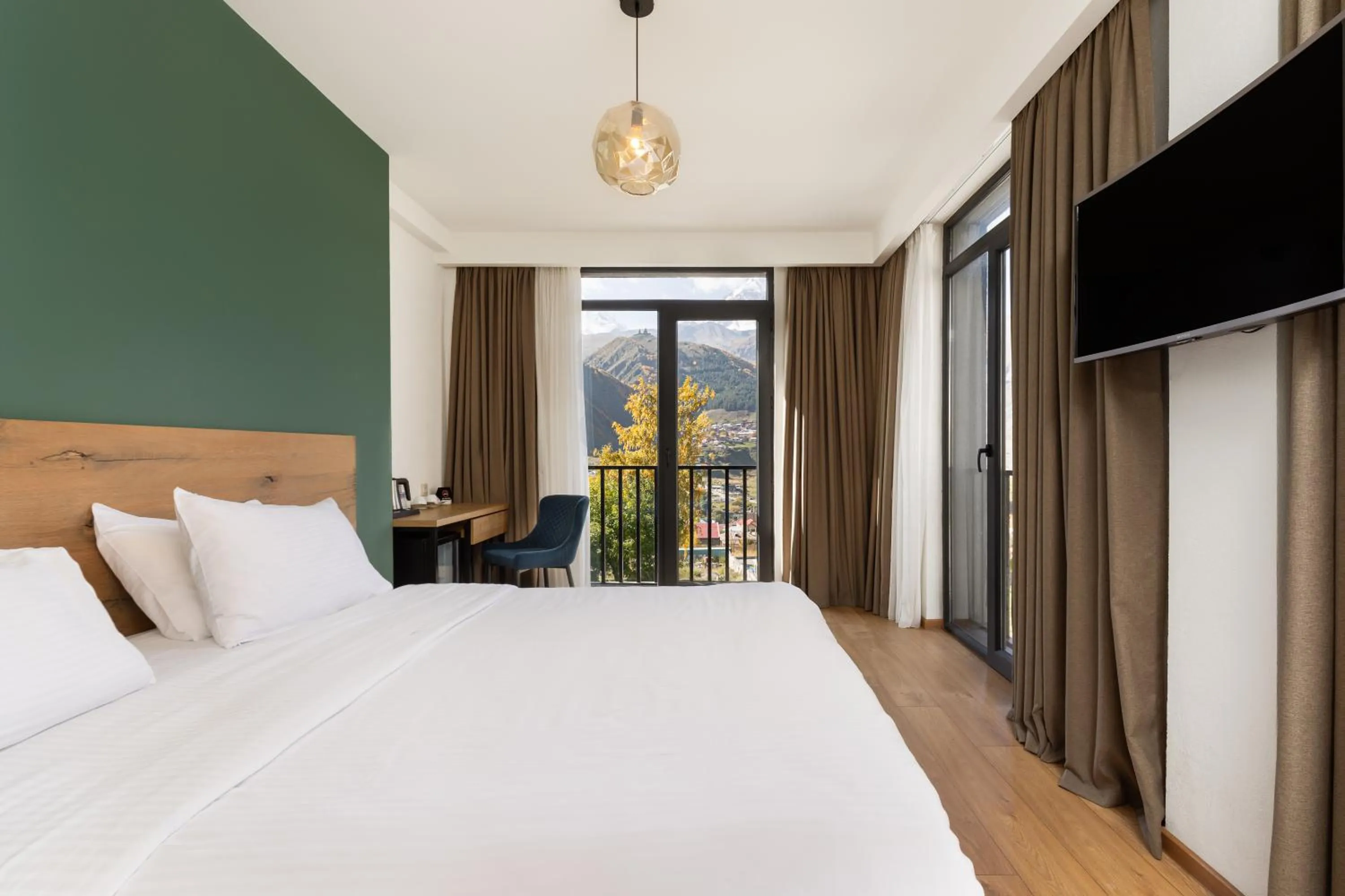 Photo of the whole room, Bed in Intourist Kazbegi