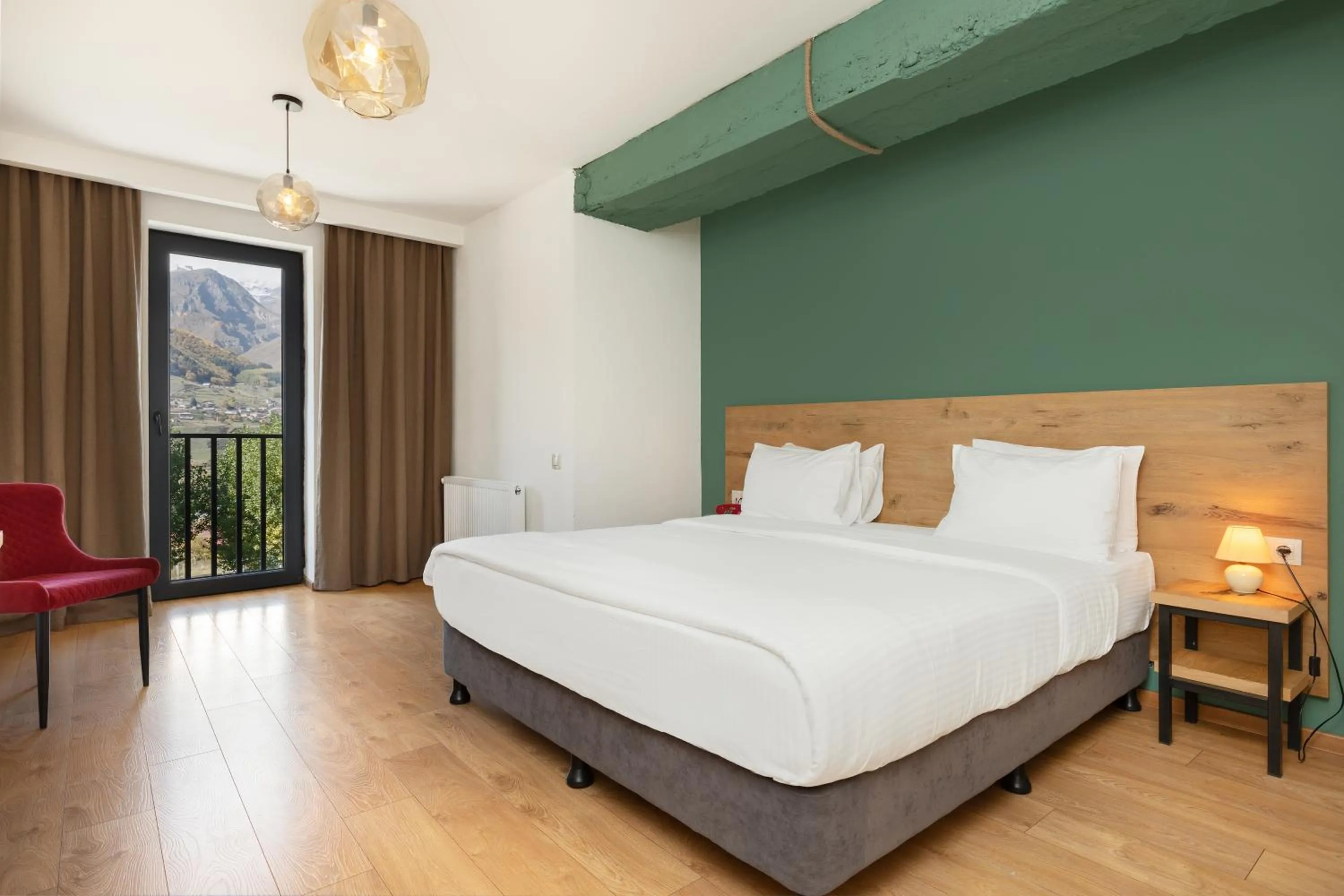 Photo of the whole room, Bed in Intourist Kazbegi