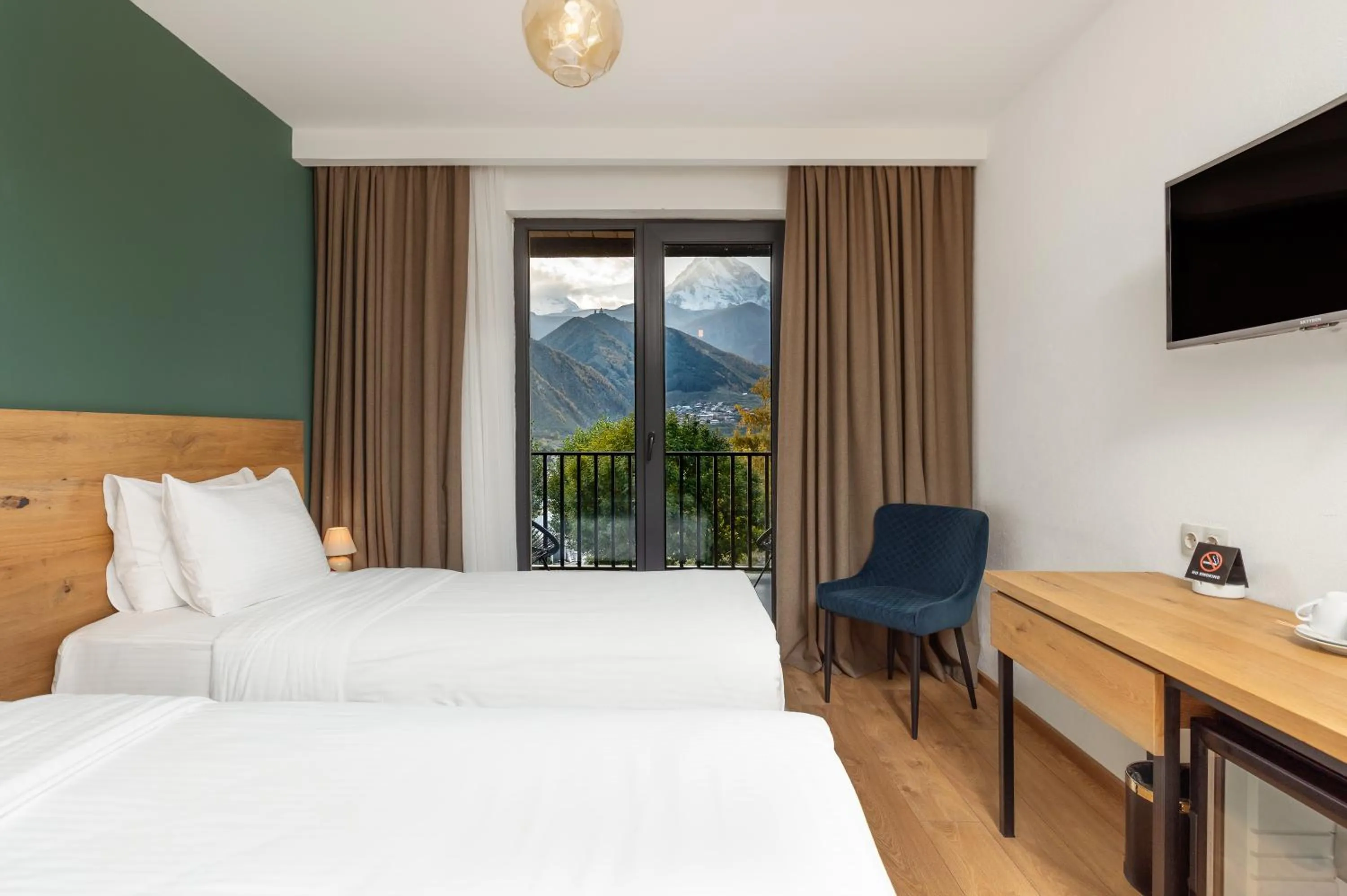 Photo of the whole room, Bed in Intourist Kazbegi