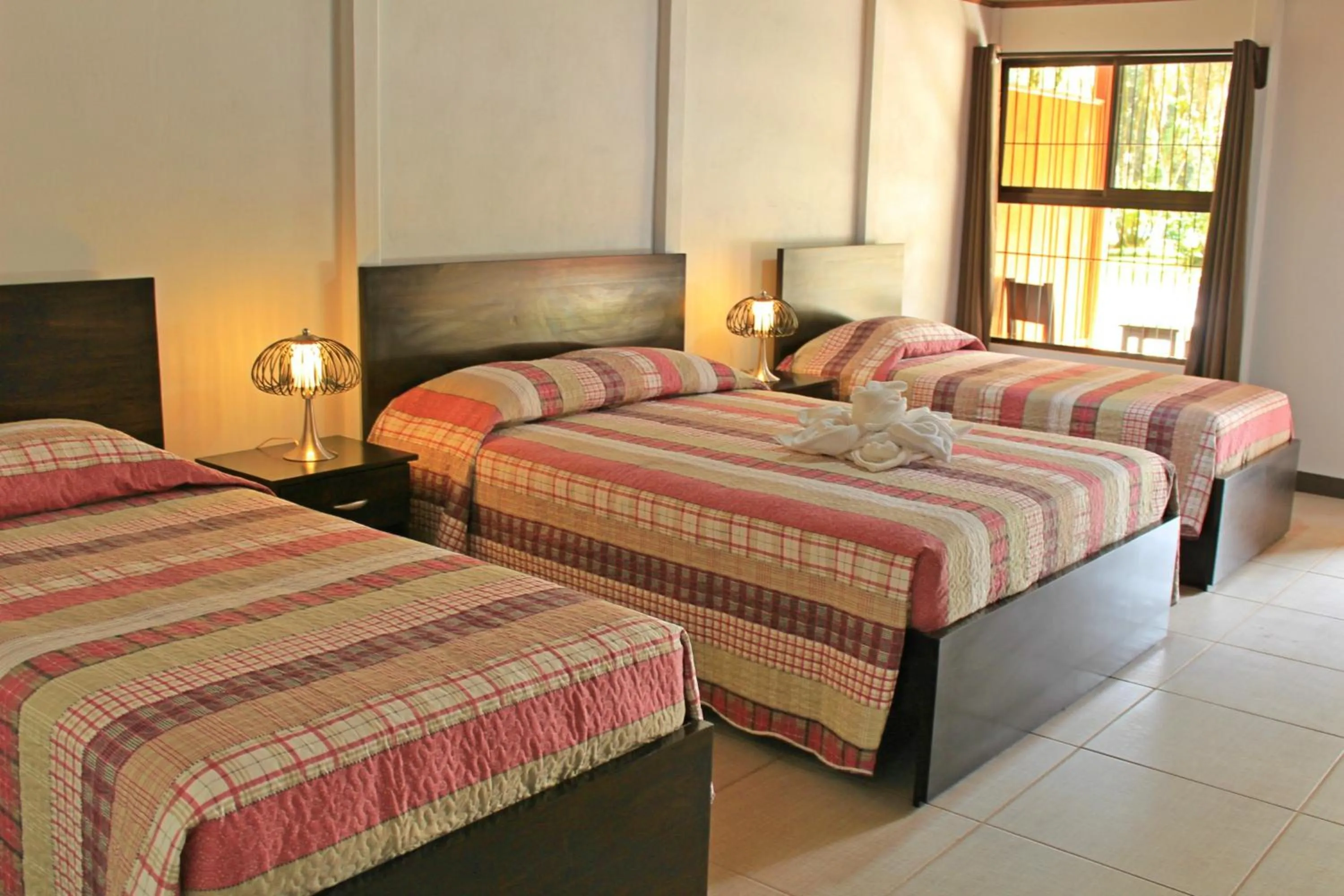 Bed in Hotel Arenal Country Inn