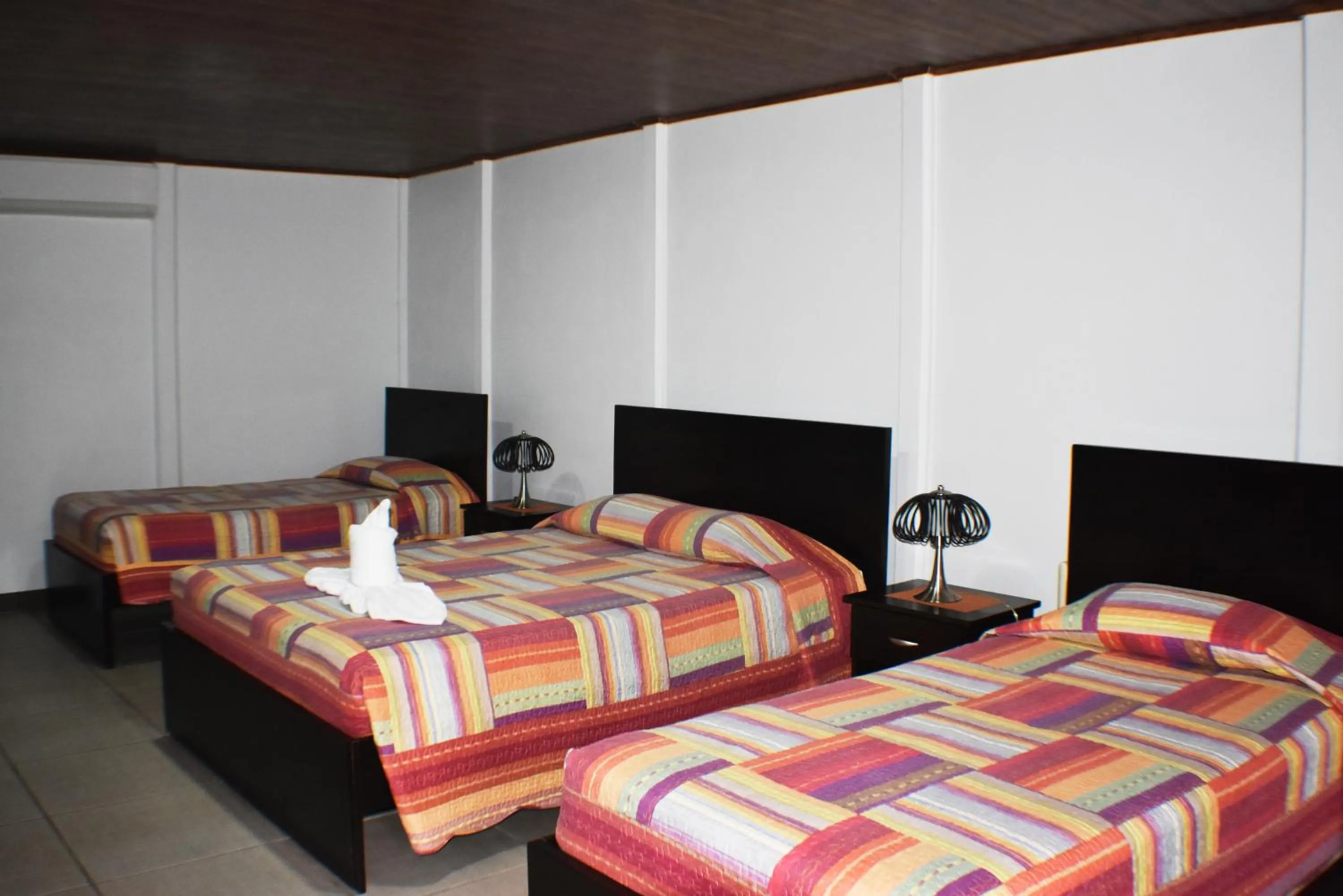 Bed in Hotel Arenal Country Inn