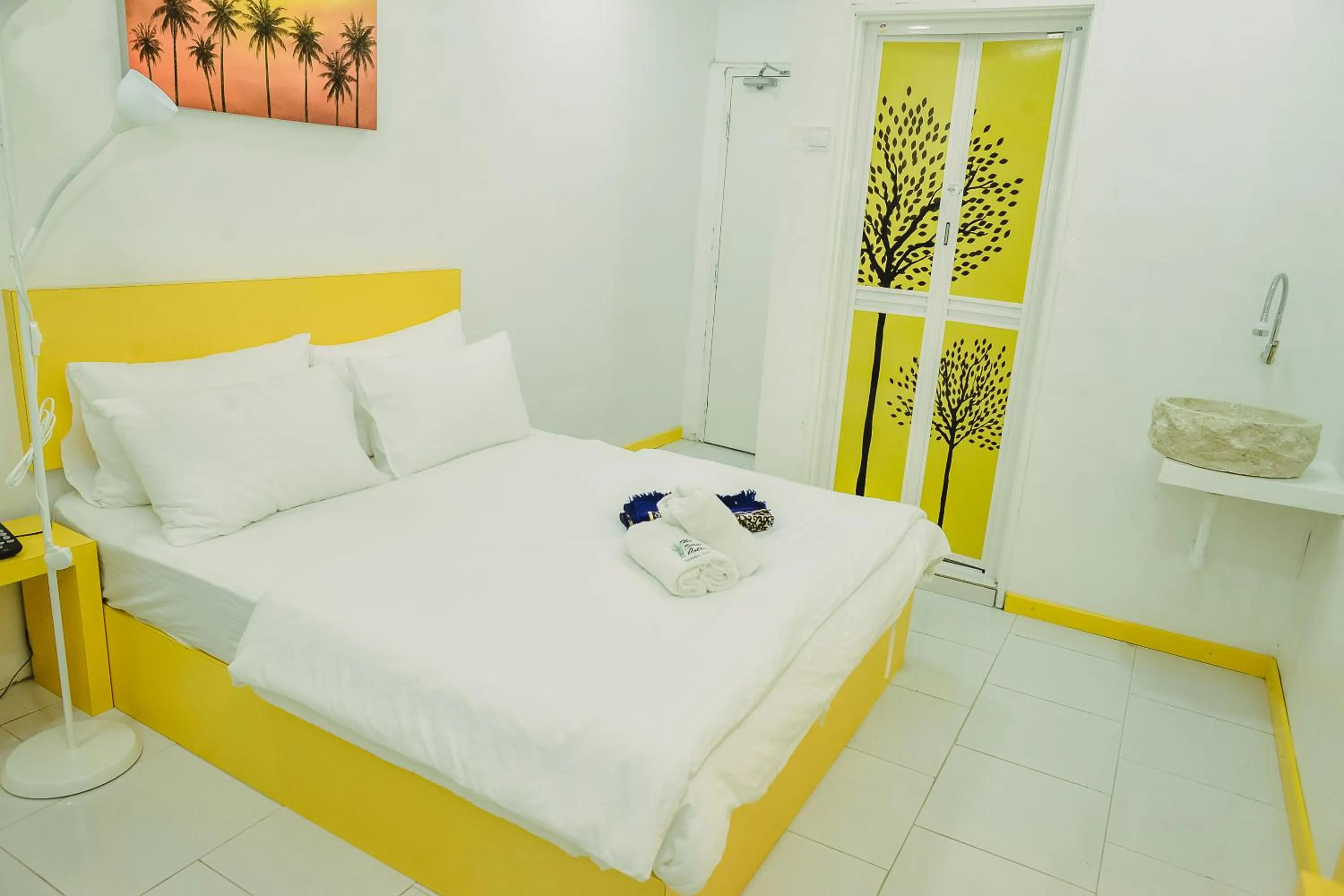 Bed in The Serai Cottage Downtown Hotel