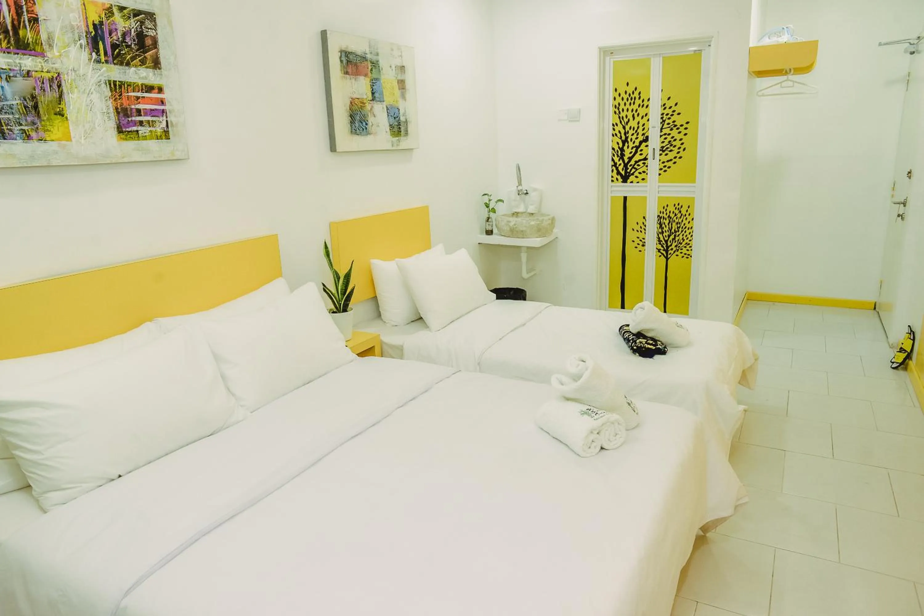 Bed in The Serai Cottage Downtown Hotel