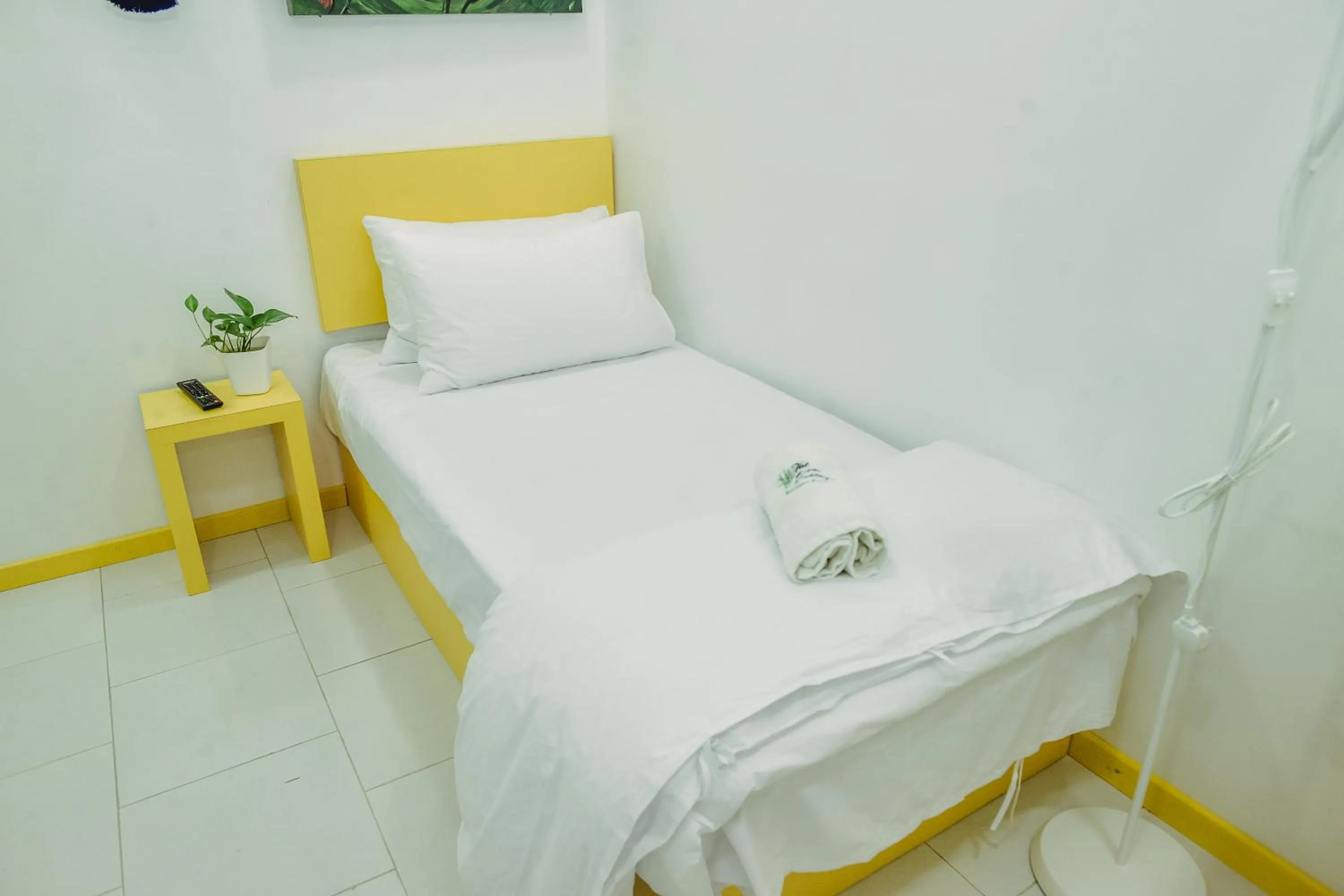 Bed in The Serai Cottage Downtown Hotel