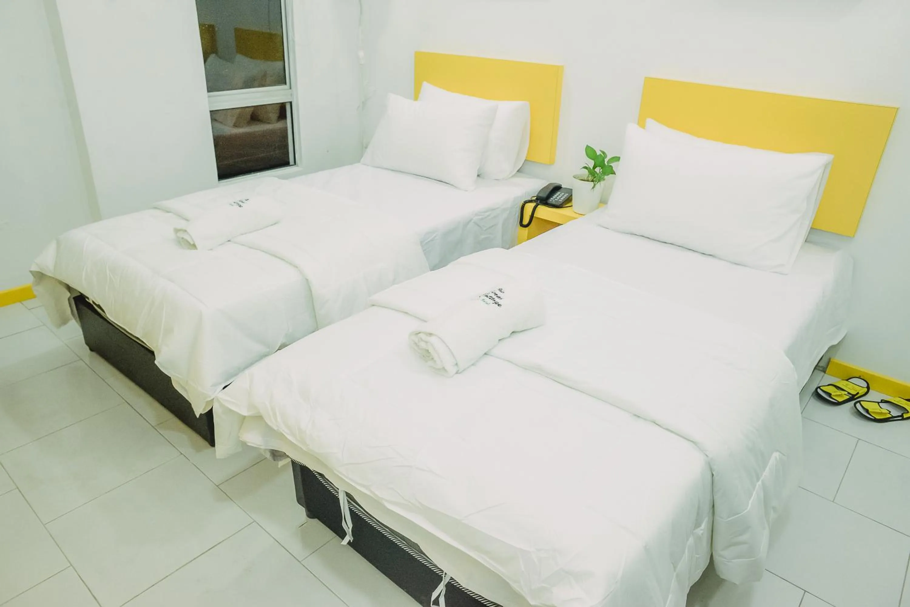 Bed in The Serai Cottage Downtown Hotel