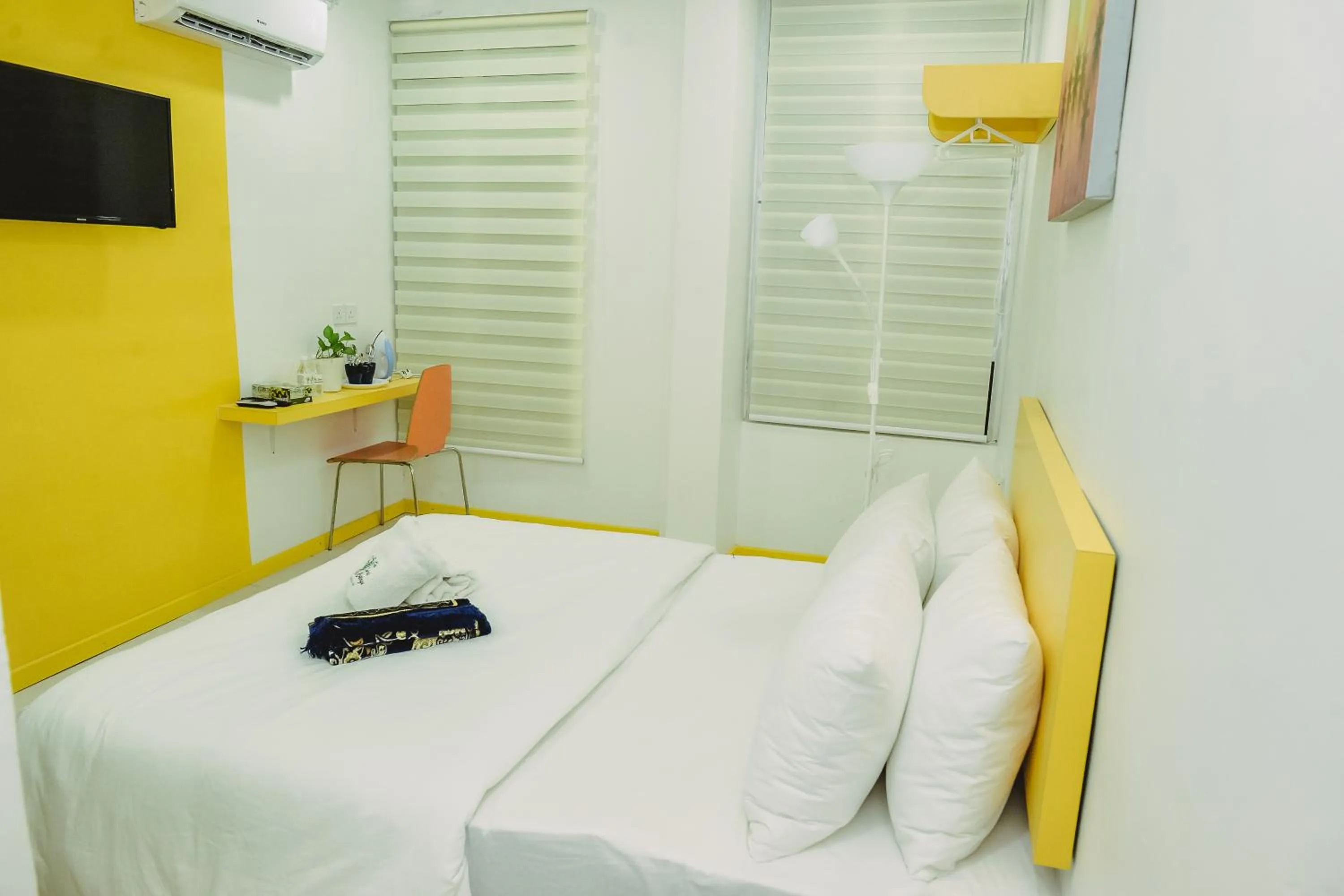 Bed in The Serai Cottage Downtown Hotel