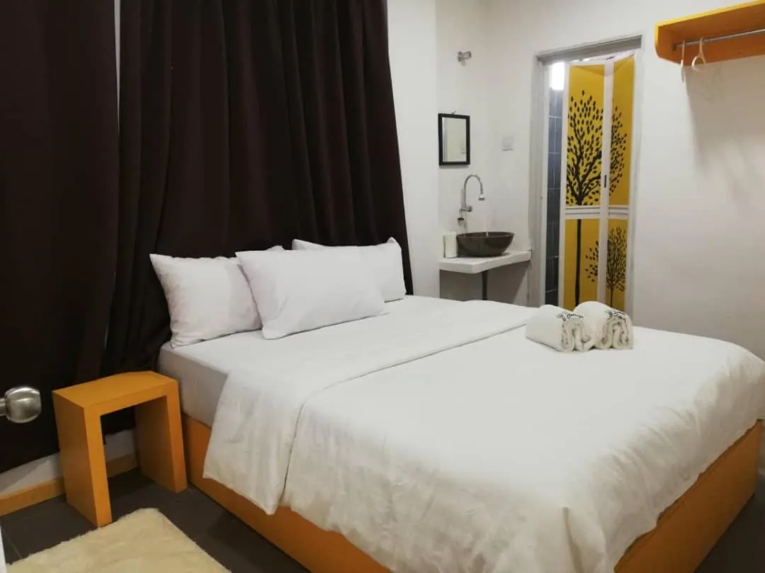 Bed in The Serai Cottage Downtown Hotel