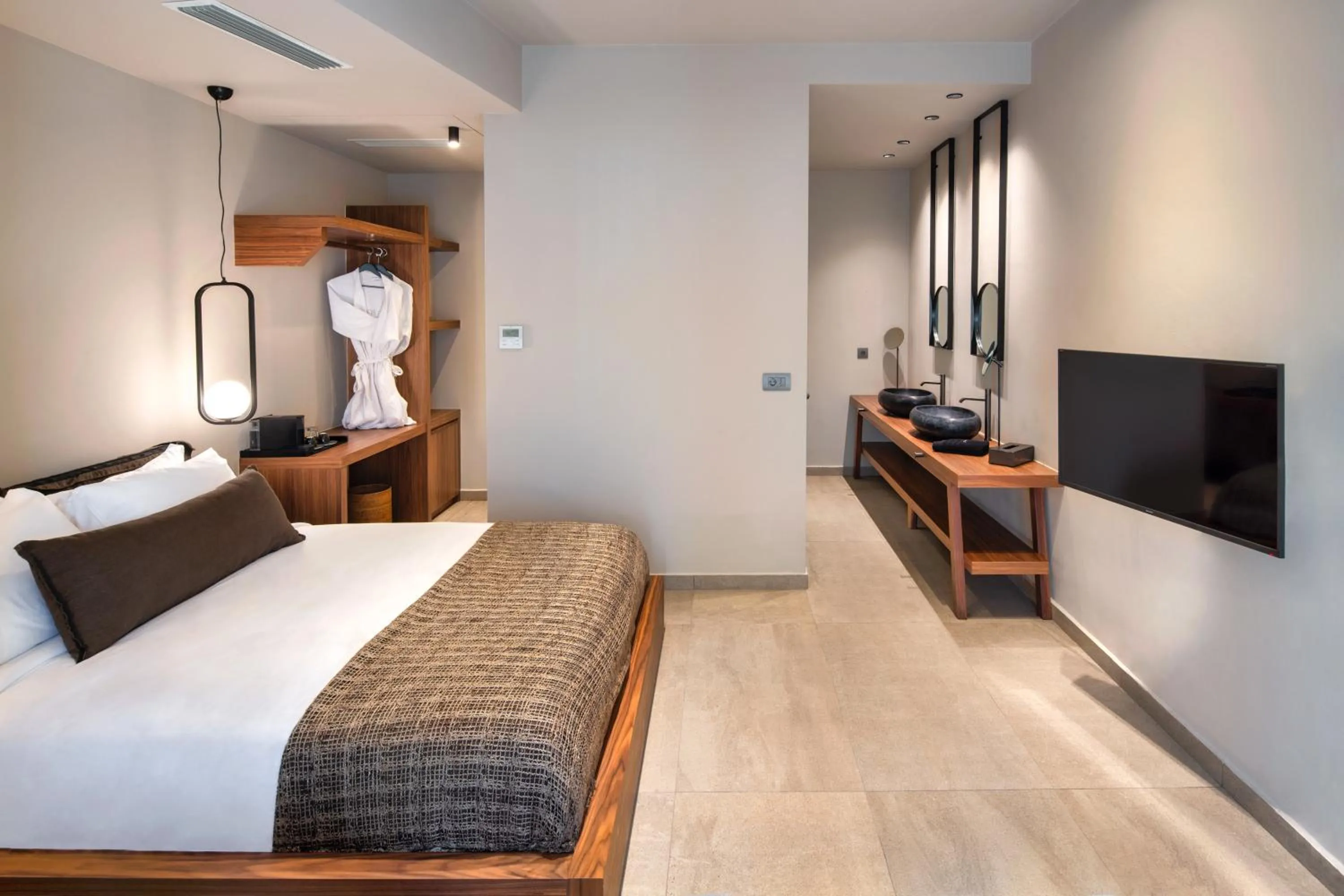 Bed in Uma Ray Suites