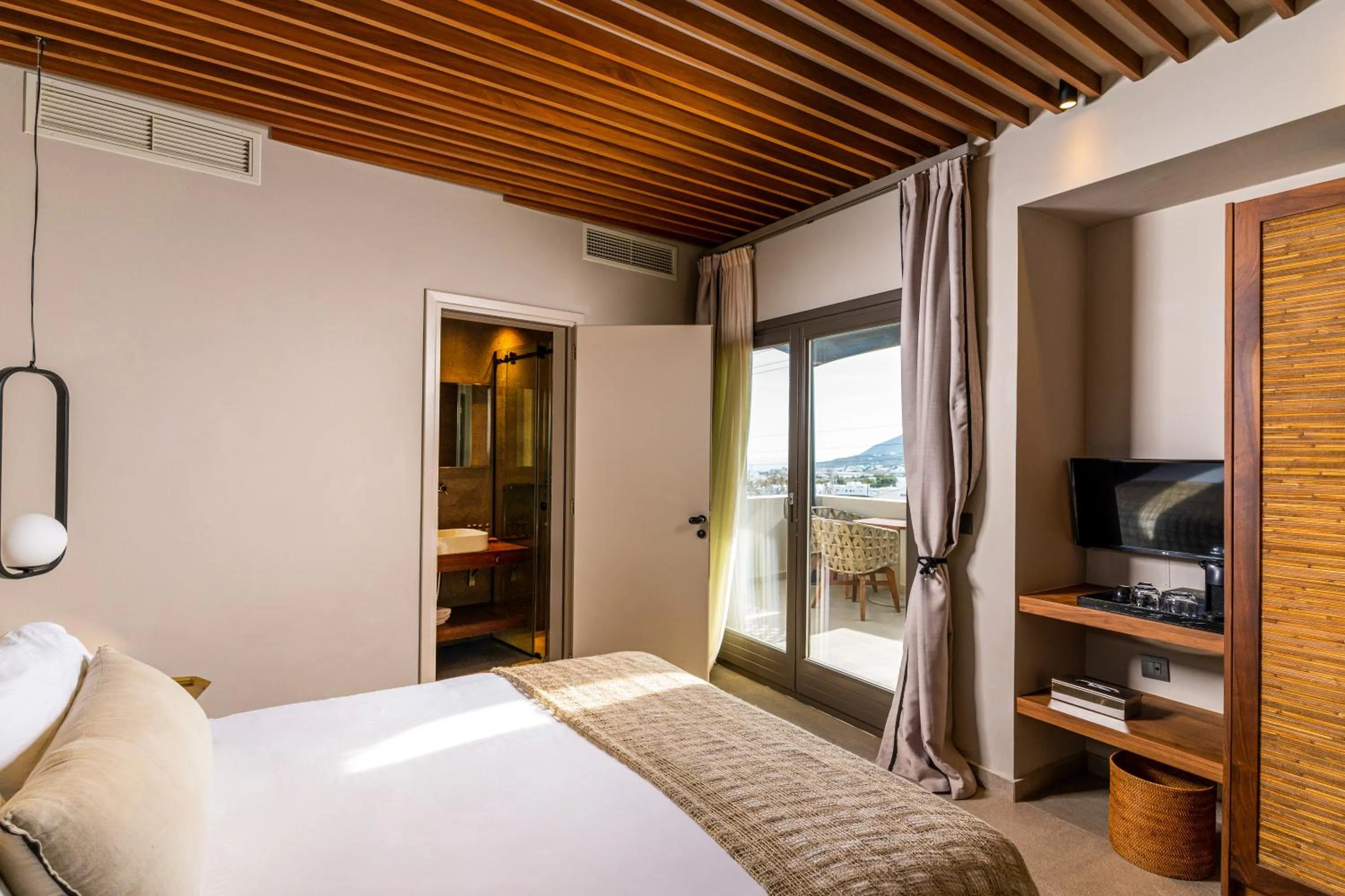 Bed in Uma Ray Suites